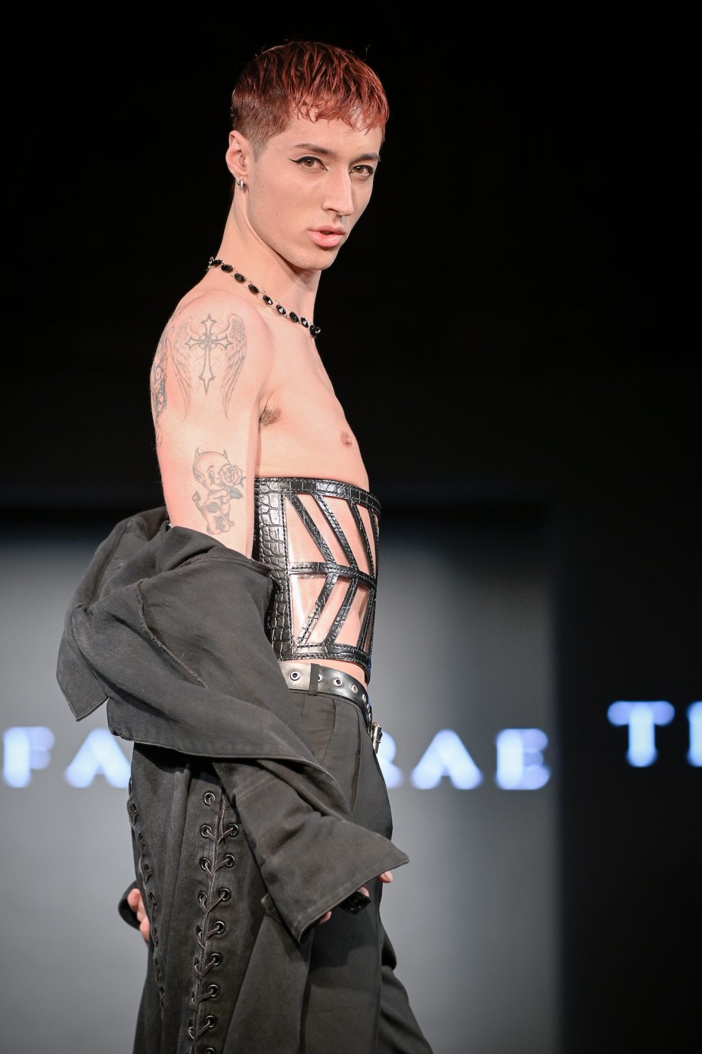 NEW YORK, NEW YORK - FEBRUARY 07: Tyler Stone walks the runway at the Tiffany Rae show during New York Fashion Week Powered By Art Hearts Fashion at The Angel Orensanz Foundation on February 07, 2025 in New York City. (Photo by Arun Nevader/Getty Images for Art Hearts Fashion)