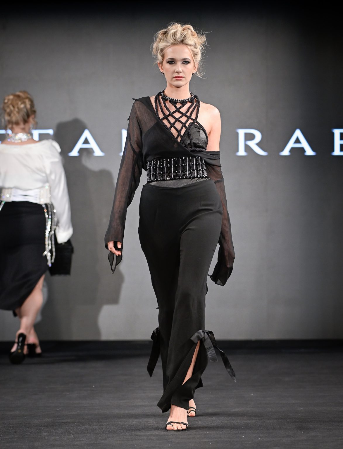 NEW YORK, NEW YORK - FEBRUARY 07: Model Abbey Christine walks the runway at the Tiffany Rae show during New York Fashion Week Powered By Art Hearts Fashion at The Angel Orensanz Foundation on February 07, 2025 in New York City. (Photo by Arun Nevader/Getty Images for Art Hearts Fashion)