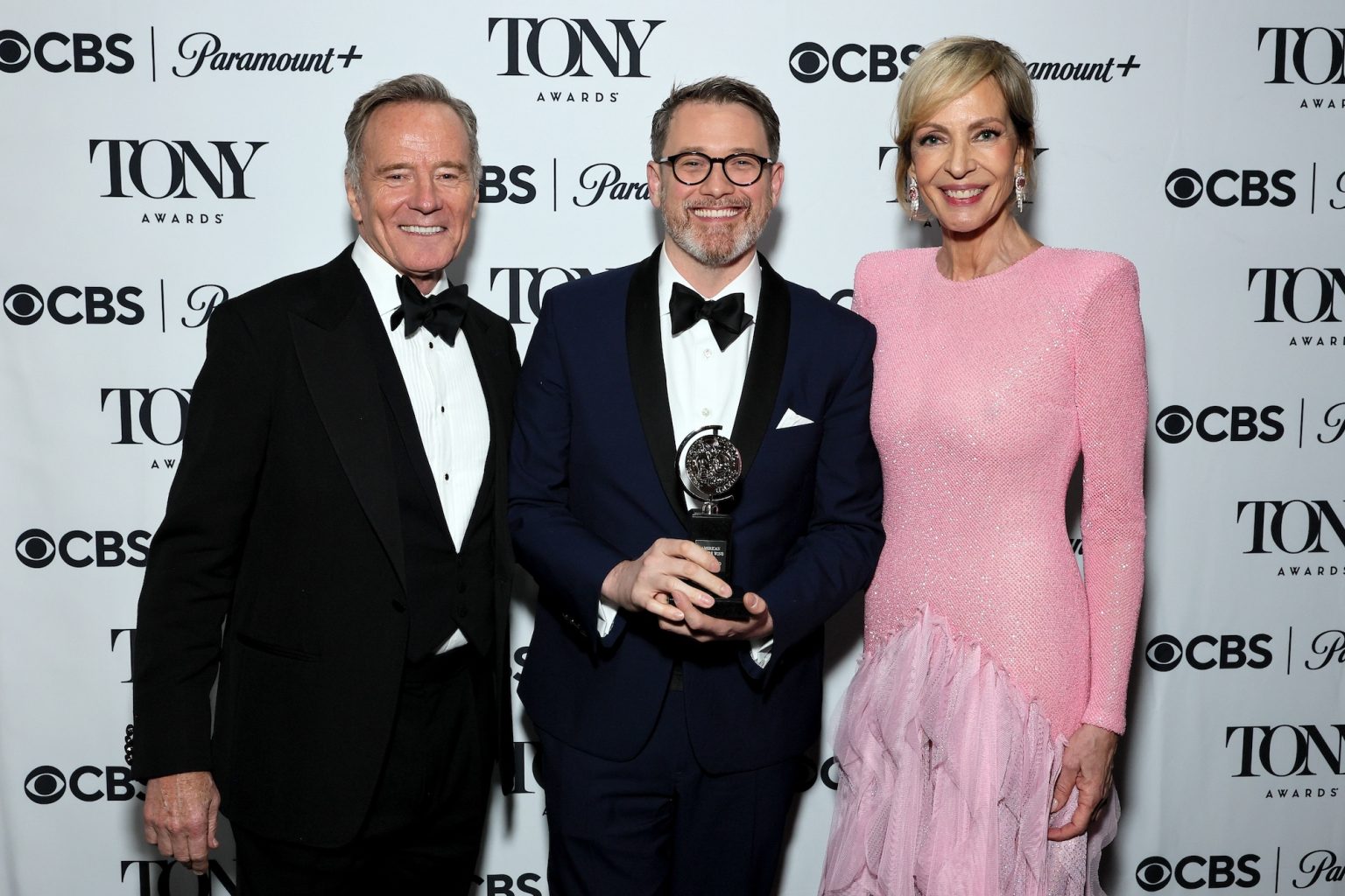 NEW YORK, NEW YORK - JUNE 08: (L-R) Bryan Cranston, Michael Arden, winner of the Best Direction of a Musical award for "Maybe Happy Ending," and Allison Janney attend The 78th Annual Tony Awards at Radio City Music Hall on June 08, 2025 in New York City. (Photo by Jemal Countess/Getty Images for Tony Awards Productions)