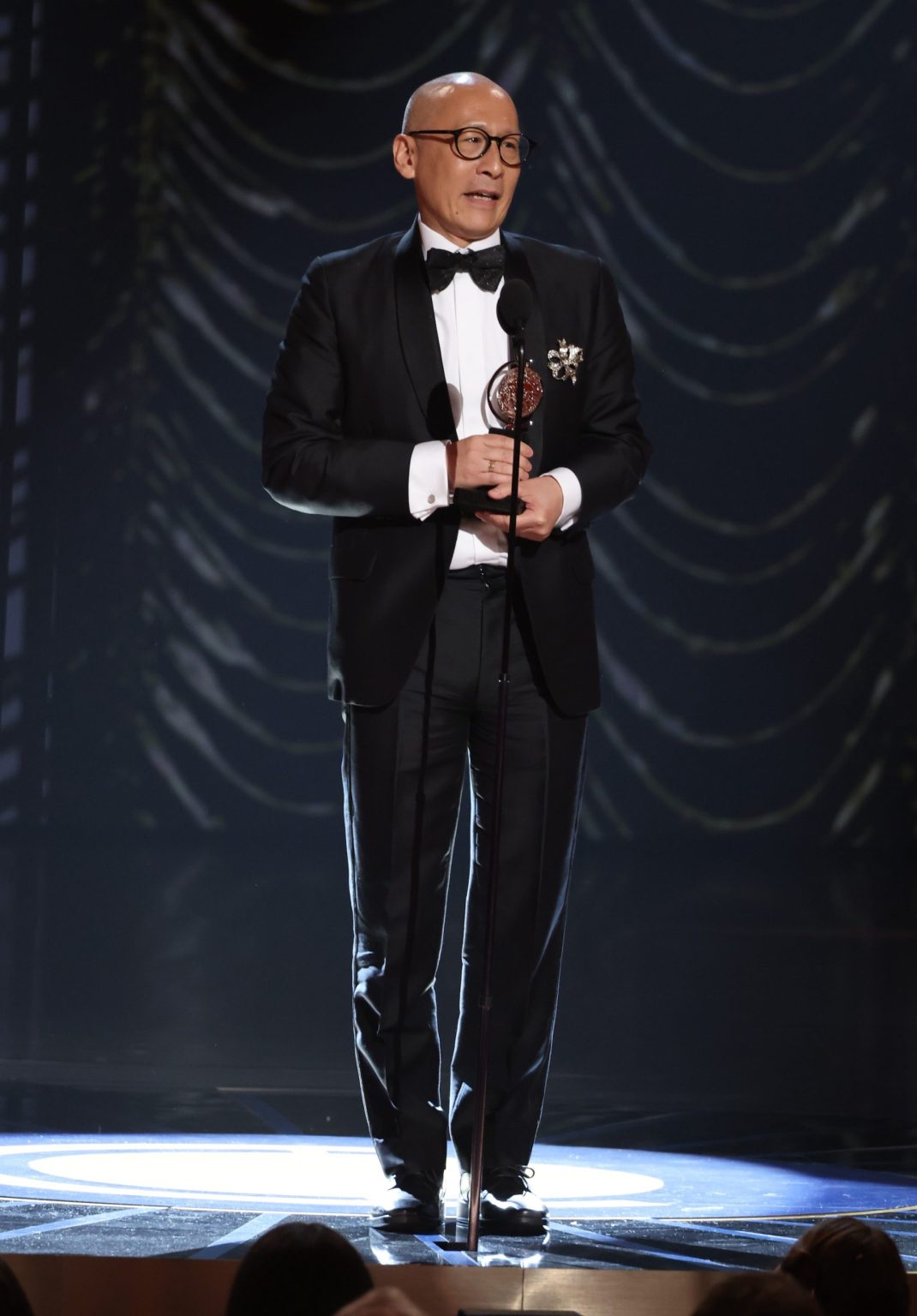 NEW YORK, NEW YORK - JUNE 08: Francis Jue accepts the Best Performance by a Featured Actor in a Play award for "Yellow Face" onstage during The 78th Annual Tony Awards at Radio City Music Hall on June 08, 2025 in New York City. (Photo by Kevin Mazur/Getty Images for Tony Awards Productions)