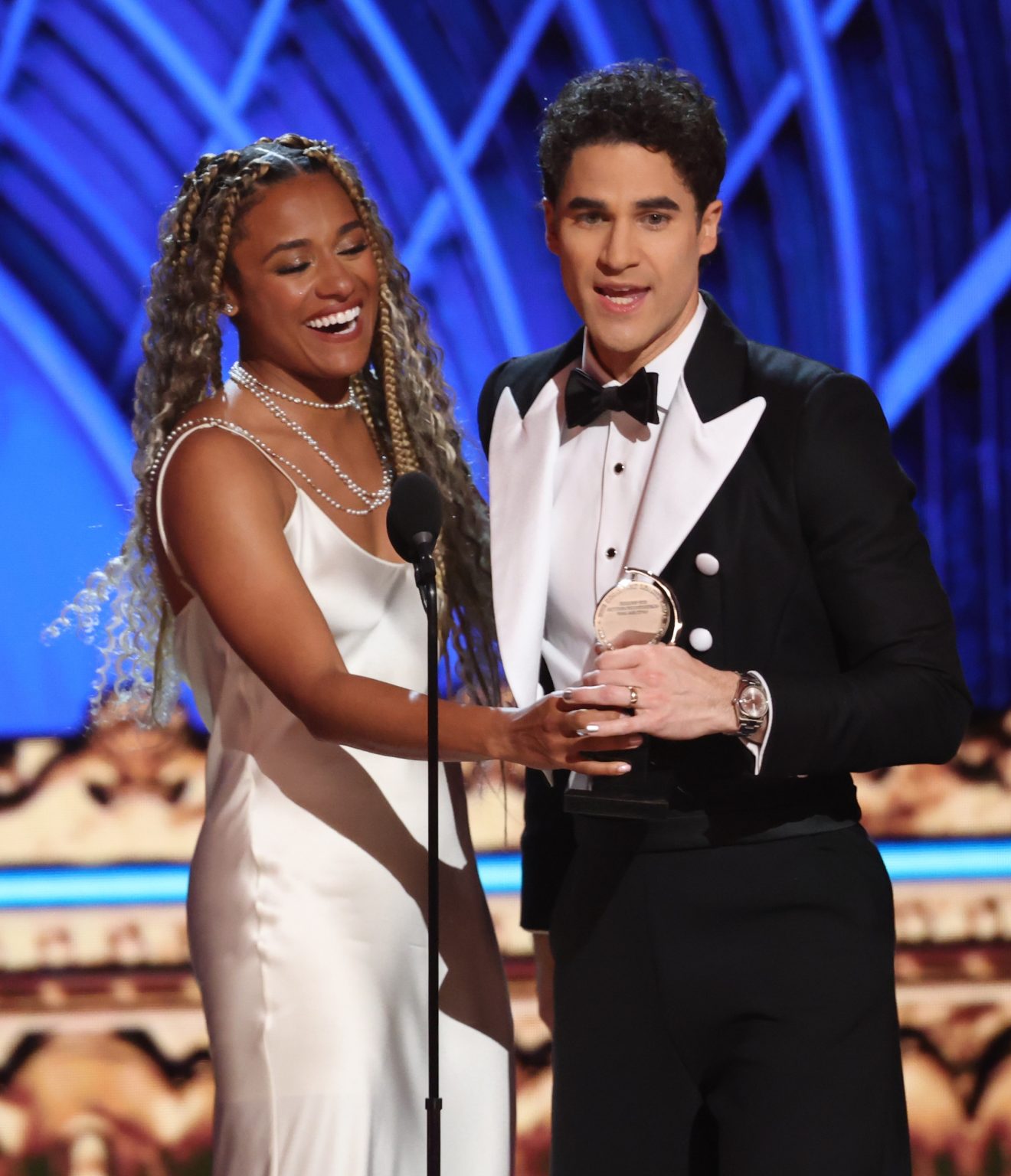 NEW YORK, NEW YORK - JUNE 08: Darren Criss (R) accepts the Best Performance by an Actor in a Leading Role in a Musical award for "Maybe Happy Ending" from Ariana DeBose (L) onstage during The 78th Annual Tony Awards at Radio City Music Hall on June 08, 2025 in New York City. (Photo by Kevin Mazur/Getty Images for Tony Awards Productions)