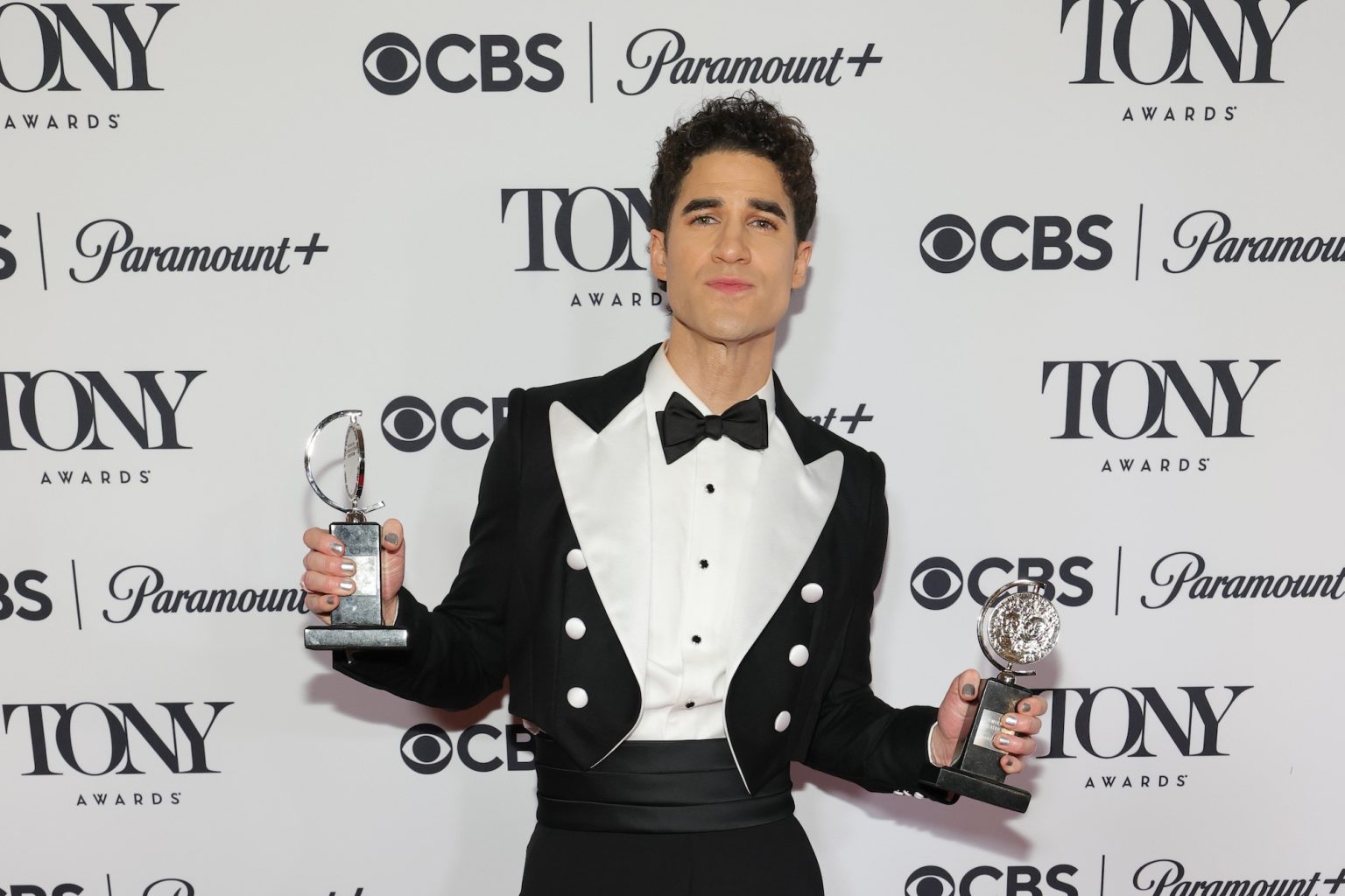 NEW YORK, NEW YORK - JUNE 08: Darren Criss poses with the Best Musical award for "Maybe Happy Ending" in The 78th Annual Tony Awards Media Room presented by Carnegie Mellon University at 3 West Club on June 08, 2025 in New York City. (Photo by Mike Coppola/Getty Images for Tony Awards Productions)