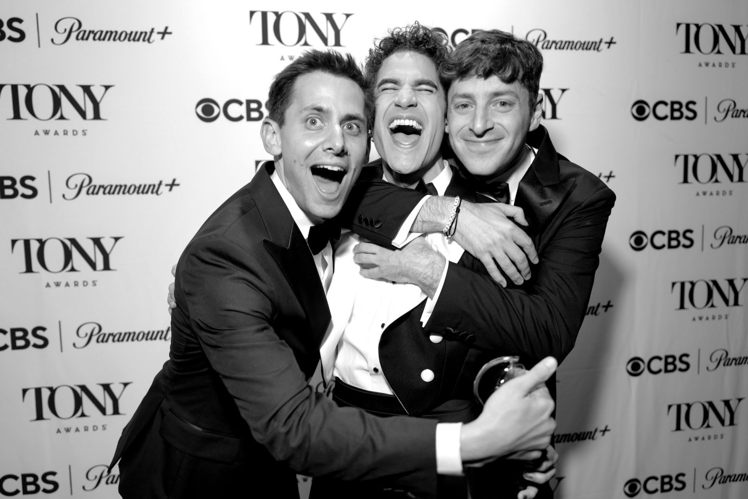NEW YORK, NEW YORK - JUNE 08: (EDITOR’S NOTE: Image has been shot in black and white. Color version not available.) (L-R) Benj Pasek, Darren Criss and Alex Edelman attend The 78th Annual Tony Awards at Radio City Music Hall on June 08, 2025 in New York City. (Photo by Jenny Anderson/Getty Images for Tony Awards Productions)