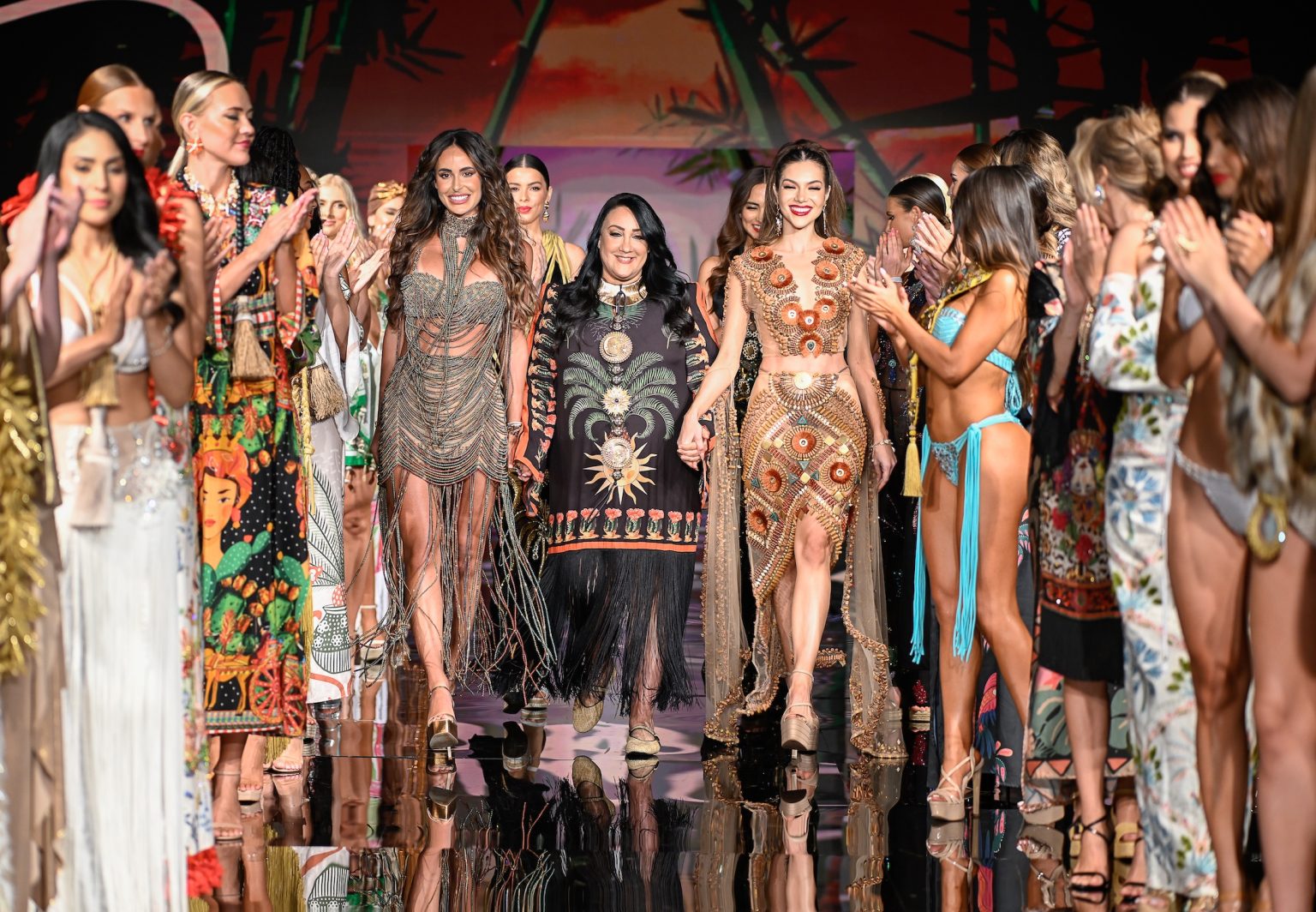 MIAMI BEACH, FLORIDA - MAY 29: Designer Giannina Azar and models walk the runway at the Giannina Azar show during Miami Swim Week Powered By Art Hearts Fashion at Eden Roc Hotel on May 29, 2025 in Miami Beach, Florida. (Photo by Arun Nevader/Getty Images for Art Hearts Fashion)