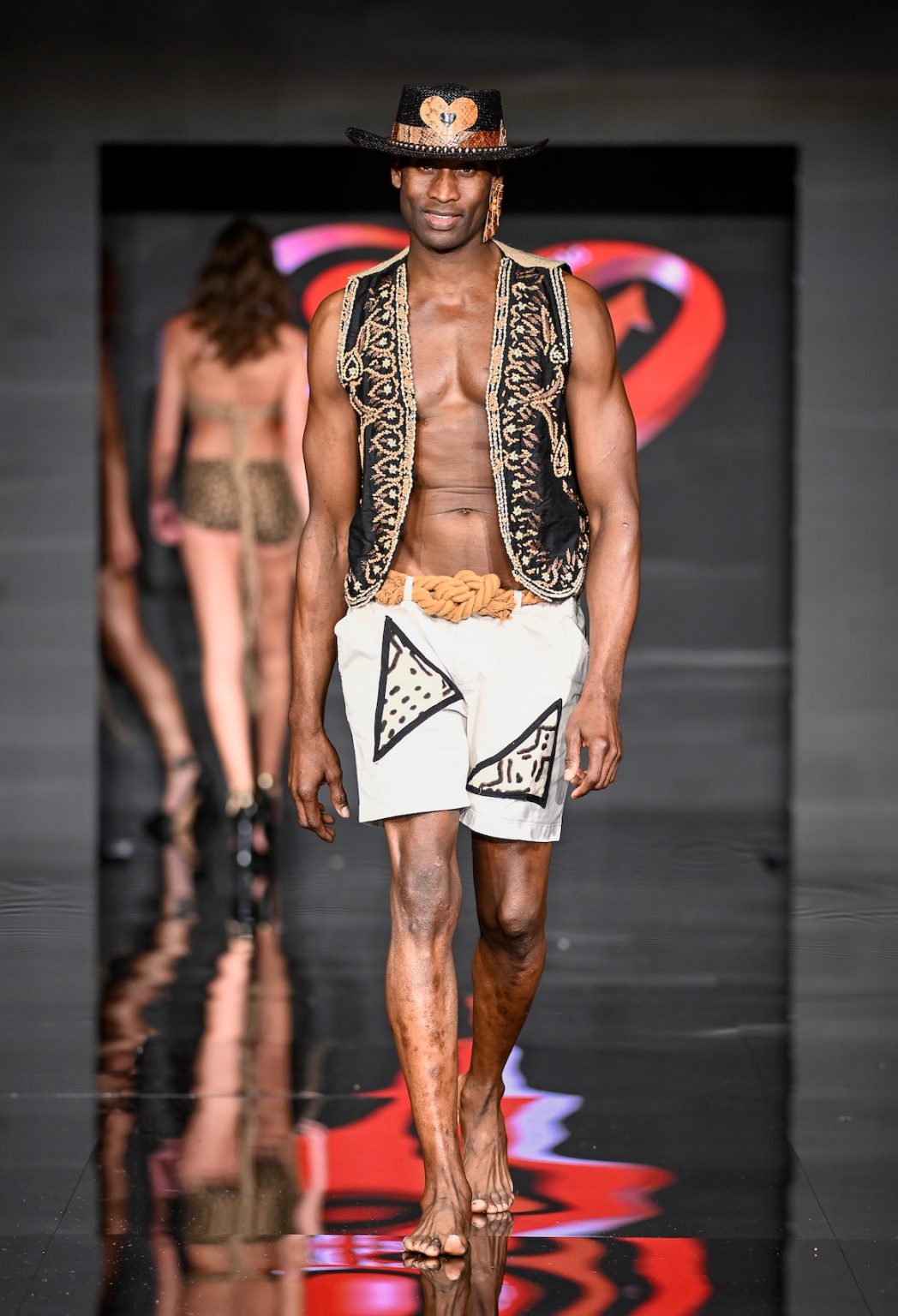 MIAMI BEACH, FLORIDA - MAY 31: A model walks the runway at the Love For Upcycling show during Miami Swim Week Powered By Art Hearts Fashion at Eden Roc Hotel on May 31, 2025 in Miami Beach, Florida. (Photo by Arun Nevader/Getty Images for Art Hearts Fashion)