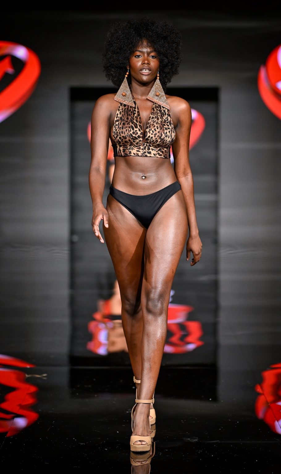 MIAMI BEACH, FLORIDA - MAY 31: A model walks the runway at the Love For Upcycling show during Miami Swim Week Powered By Art Hearts Fashion at Eden Roc Hotel on May 31, 2025 in Miami Beach, Florida. (Photo by Arun Nevader/Getty Images for Art Hearts Fashion)