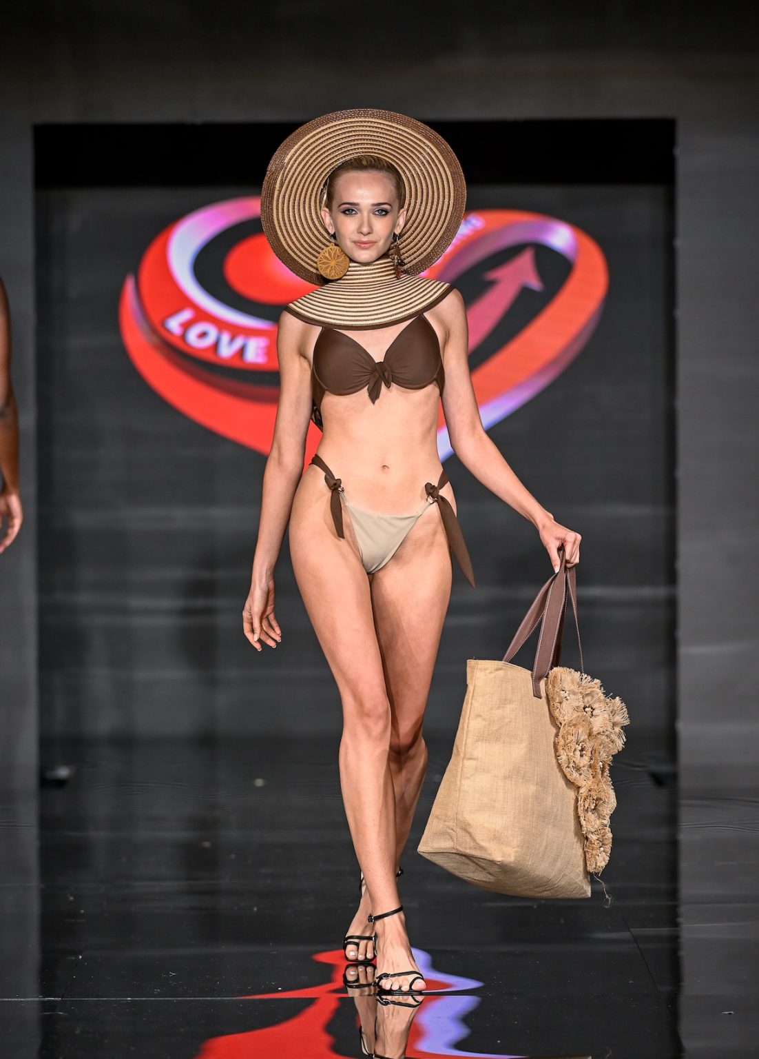 MIAMI BEACH, FLORIDA - MAY 31: Abbey Christine walks the runway at the Love For Upcycling show during Miami Swim Week Powered By Art Hearts Fashion at Eden Roc Hotel on May 31, 2025 in Miami Beach, Florida. (Photo by Arun Nevader/Getty Images for Art Hearts Fashion)