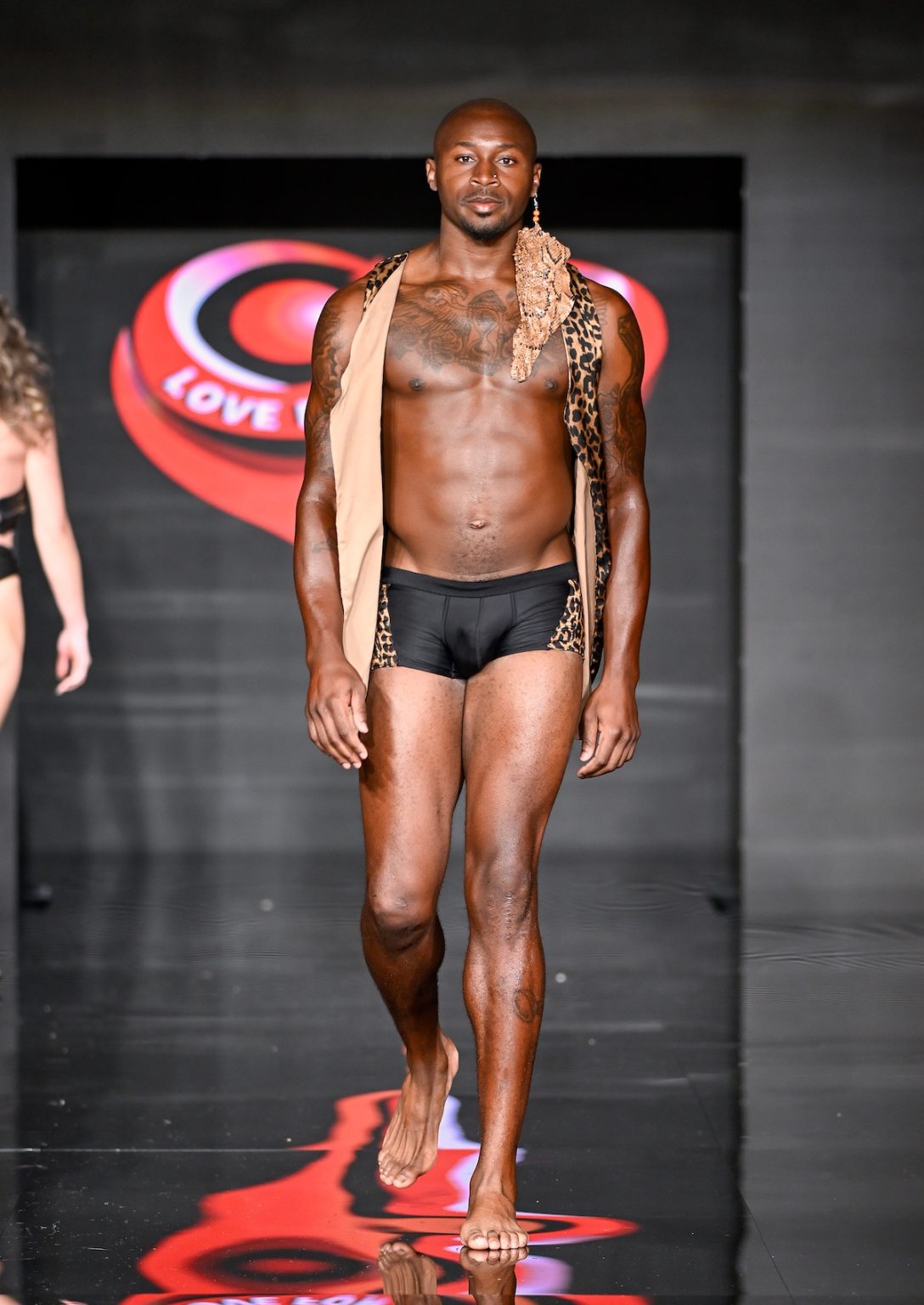 MIAMI BEACH, FLORIDA - MAY 31: Jamel Dean walks the runway at the Love For Upcycling Tampa Bay Fashion Experience show during Miami Swim Week Powered By Art Hearts Fashion at Eden Roc Hotel on May 31, 2025 in Miami Beach, Florida. (Photo by Arun Nevader/Getty Images for Art Hearts Fashion)