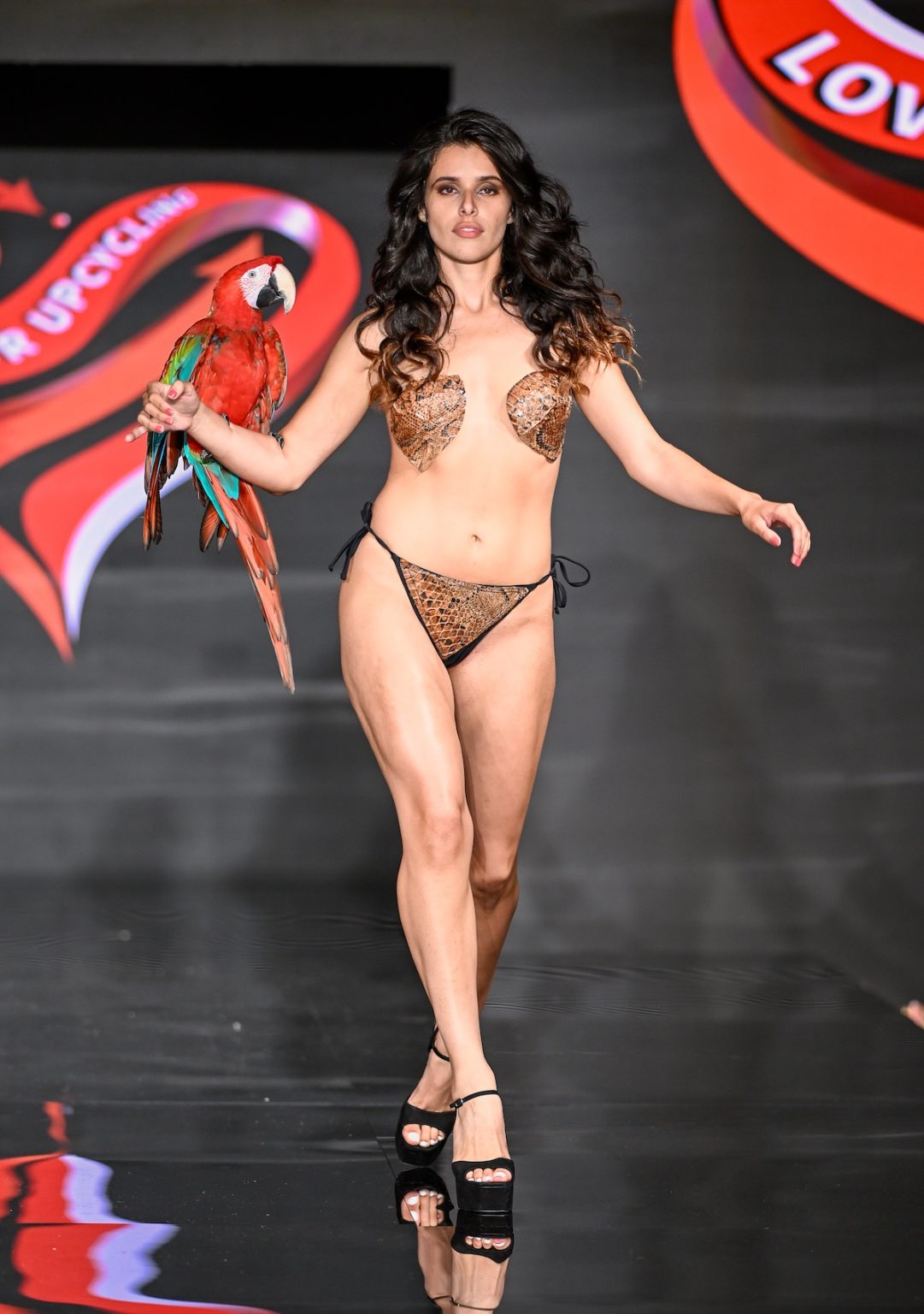 MIAMI BEACH, FLORIDA - MAY 31: A model walks the runway at the Love For Upcycling show during Miami Swim Week Powered By Art Hearts Fashion at Eden Roc Hotel on May 31, 2025 in Miami Beach, Florida. (Photo by Arun Nevader/Getty Images for Art Hearts Fashion)