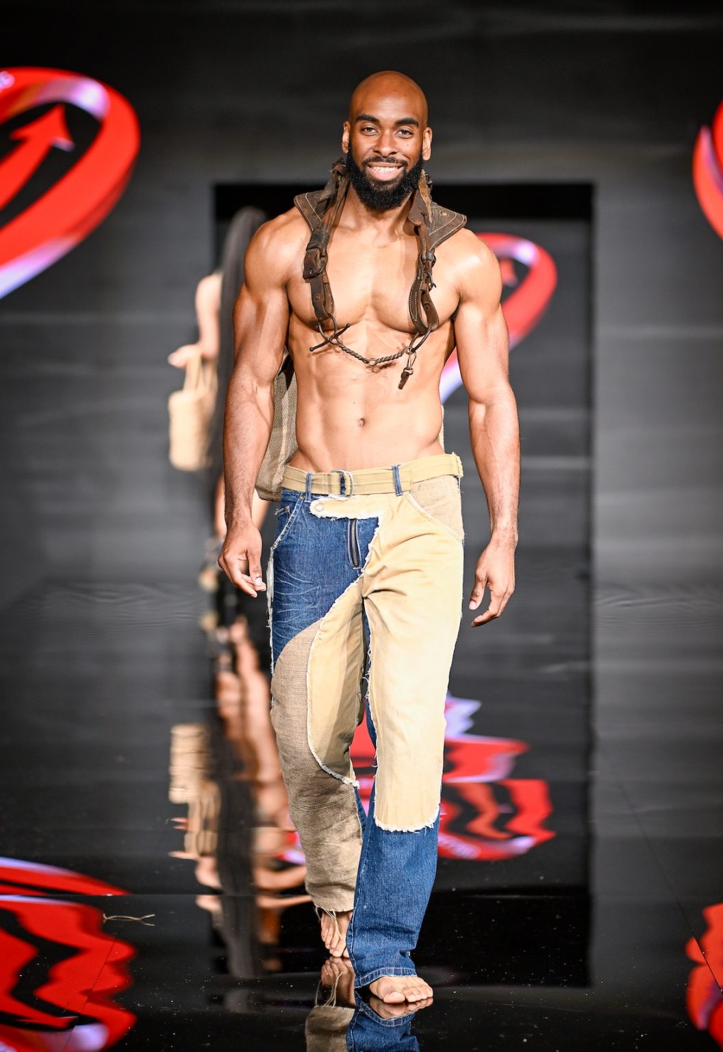 MIAMI BEACH, FLORIDA - MAY 31: A model walks the runway at the Love For Upcycling show during Miami Swim Week Powered By Art Hearts Fashion at Eden Roc Hotel on May 31, 2025 in Miami Beach, Florida. (Photo by Arun Nevader/Getty Images for Art Hearts Fashion)