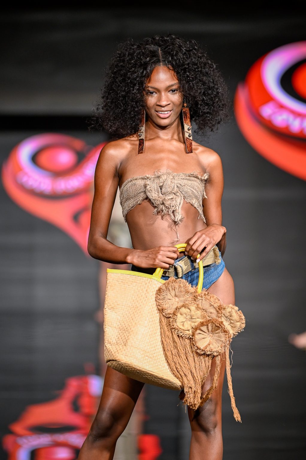 MIAMI BEACH, FLORIDA - MAY 31: A model walks the runway at the Love For Upcycling show during Miami Swim Week Powered By Art Hearts Fashion at Eden Roc Hotel on May 31, 2025 in Miami Beach, Florida. (Photo by Arun Nevader/Getty Images for Art Hearts Fashion)