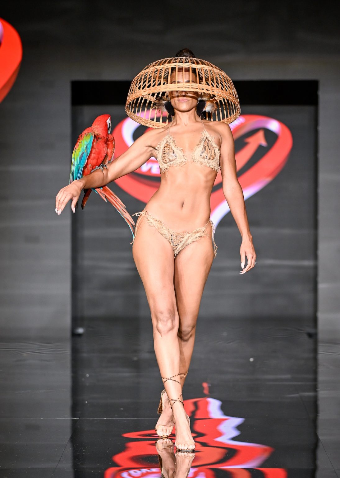 MIAMI BEACH, FLORIDA - MAY 31: A model walks the runway at the Love For Upcycling show during Miami Swim Week Powered By Art Hearts Fashion at Eden Roc Hotel on May 31, 2025 in Miami Beach, Florida. (Photo by Arun Nevader/Getty Images for Art Hearts Fashion)