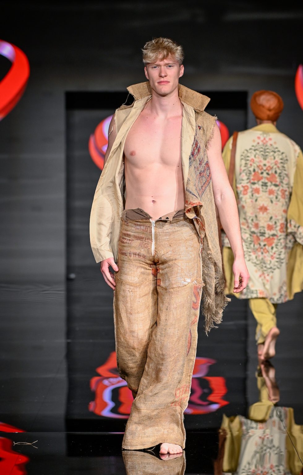 MIAMI BEACH, FLORIDA - MAY 31: A model walks the runway at the Love For Upcycling show during Miami Swim Week Powered By Art Hearts Fashion at Eden Roc Hotel on May 31, 2025 in Miami Beach, Florida. (Photo by Arun Nevader/Getty Images for Art Hearts Fashion)