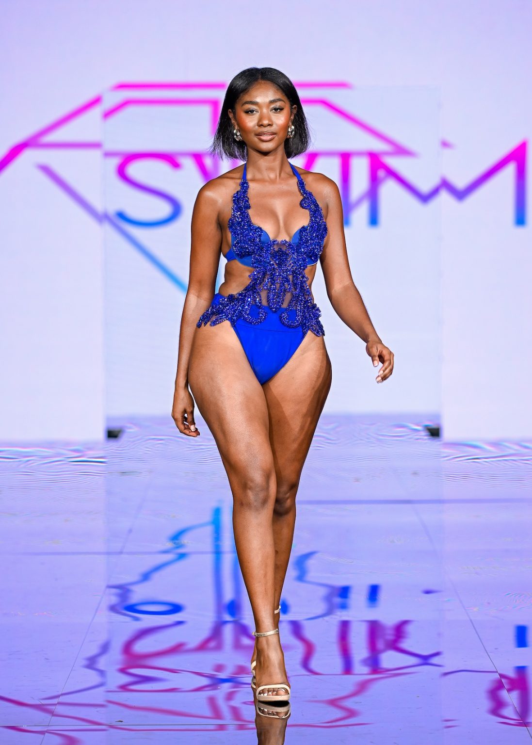 MIAMI BEACH, FLORIDA - MAY 30: A model walks the runway at the Slay Swimwear Show during Miami Swim Week Powered By Art Hearts Fashion at Eden Roc Hotel on May 30, 2025 in Miami Beach, Florida. (Photo by Arun Nevader/Getty Images for Art Hearts Fashion)