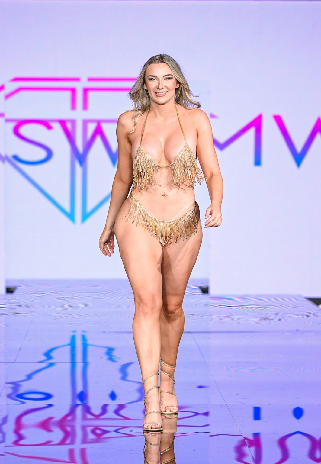 MIAMI BEACH, FLORIDA - MAY 30: A model walks the runway at the Slay Swimwear Show during Miami Swim Week Powered By Art Hearts Fashion at Eden Roc Hotel on May 30, 2025 in Miami Beach, Florida. (Photo by Arun Nevader/Getty Images for Art Hearts Fashion)