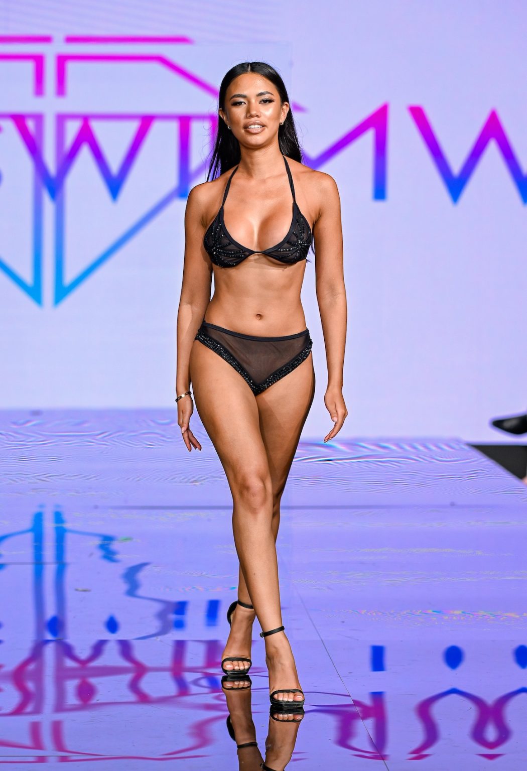 MIAMI BEACH, FLORIDA - MAY 30: A model walks the runway at the Slay Swimwear Show during Miami Swim Week Powered By Art Hearts Fashion at Eden Roc Hotel on May 30, 2025 in Miami Beach, Florida. (Photo by Arun Nevader/Getty Images for Art Hearts Fashion)