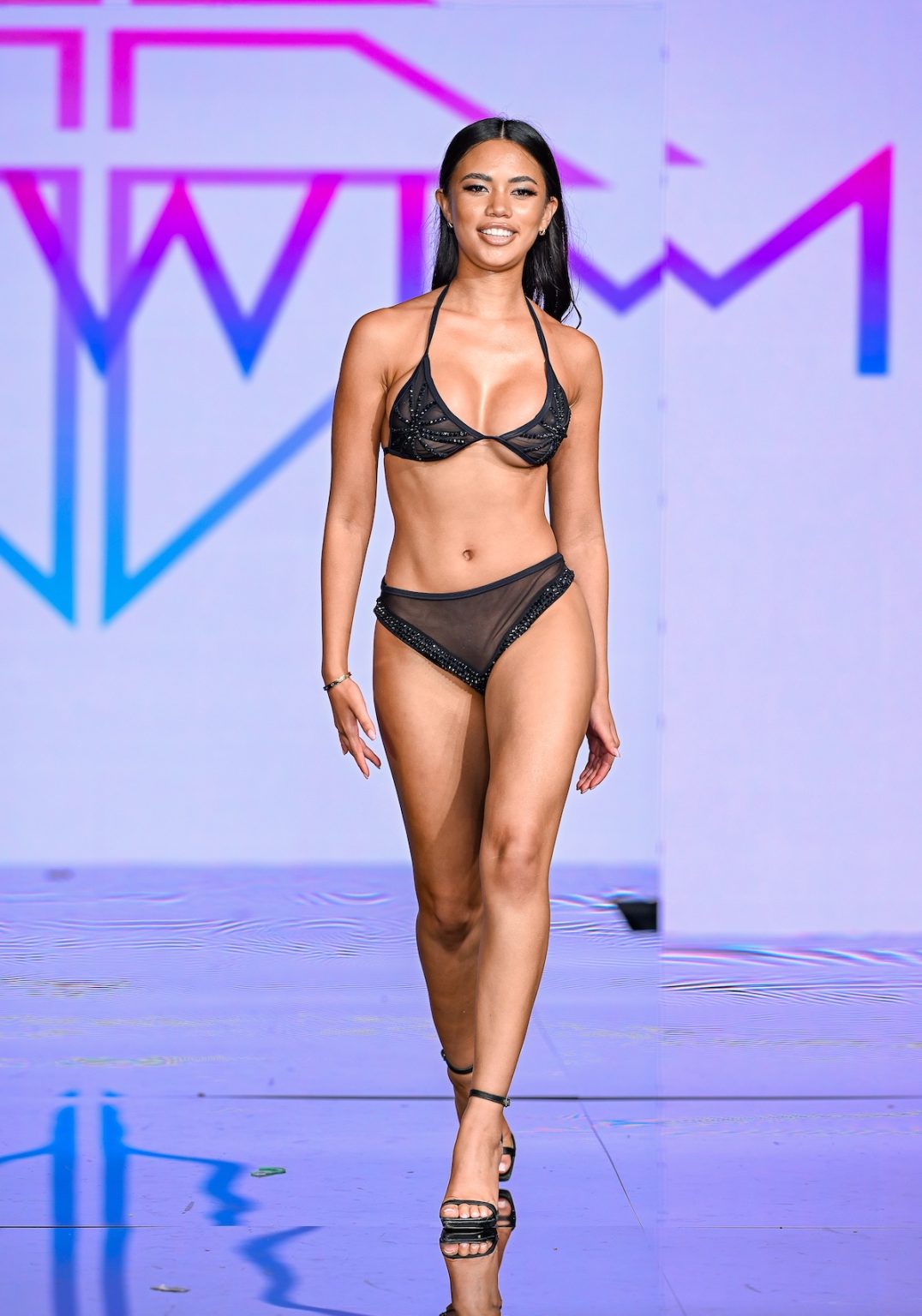 MIAMI BEACH, FLORIDA - MAY 30: A model walks the runway at the Slay Swimwear Show during Miami Swim Week Powered By Art Hearts Fashion at Eden Roc Hotel on May 30, 2025 in Miami Beach, Florida. (Photo by Arun Nevader/Getty Images for Art Hearts Fashion)