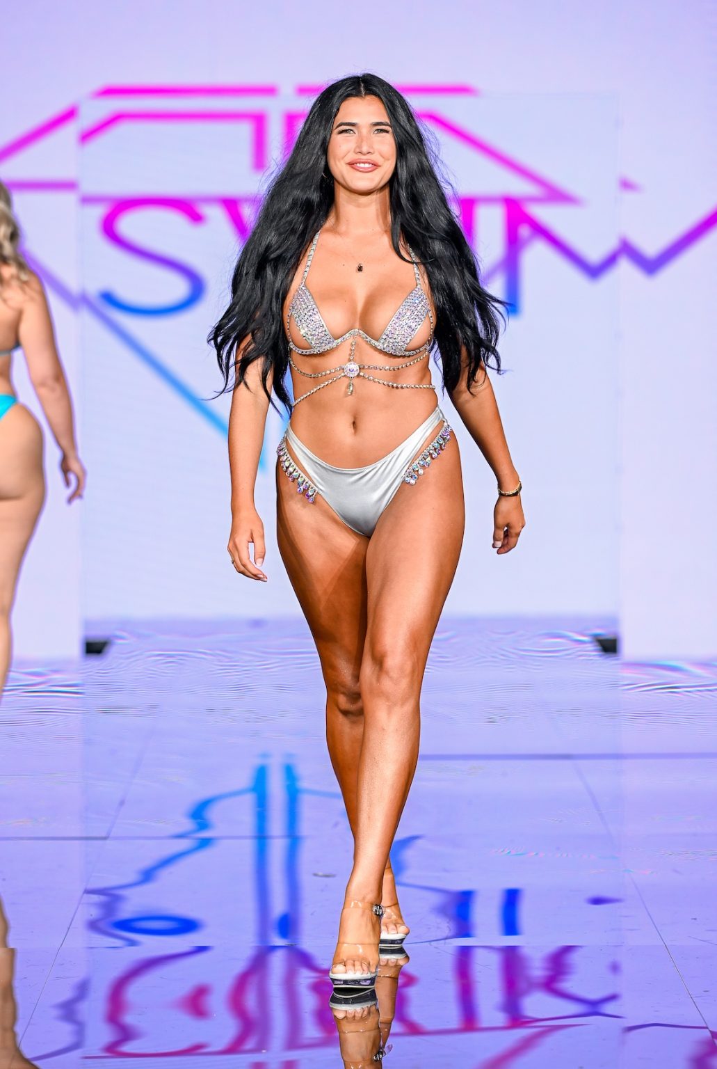 MIAMI BEACH, FLORIDA - MAY 30: A model walks the runway at the Slay Swimwear Show during Miami Swim Week Powered By Art Hearts Fashion at Eden Roc Hotel on May 30, 2025 in Miami Beach, Florida. (Photo by Arun Nevader/Getty Images for Art Hearts Fashion)