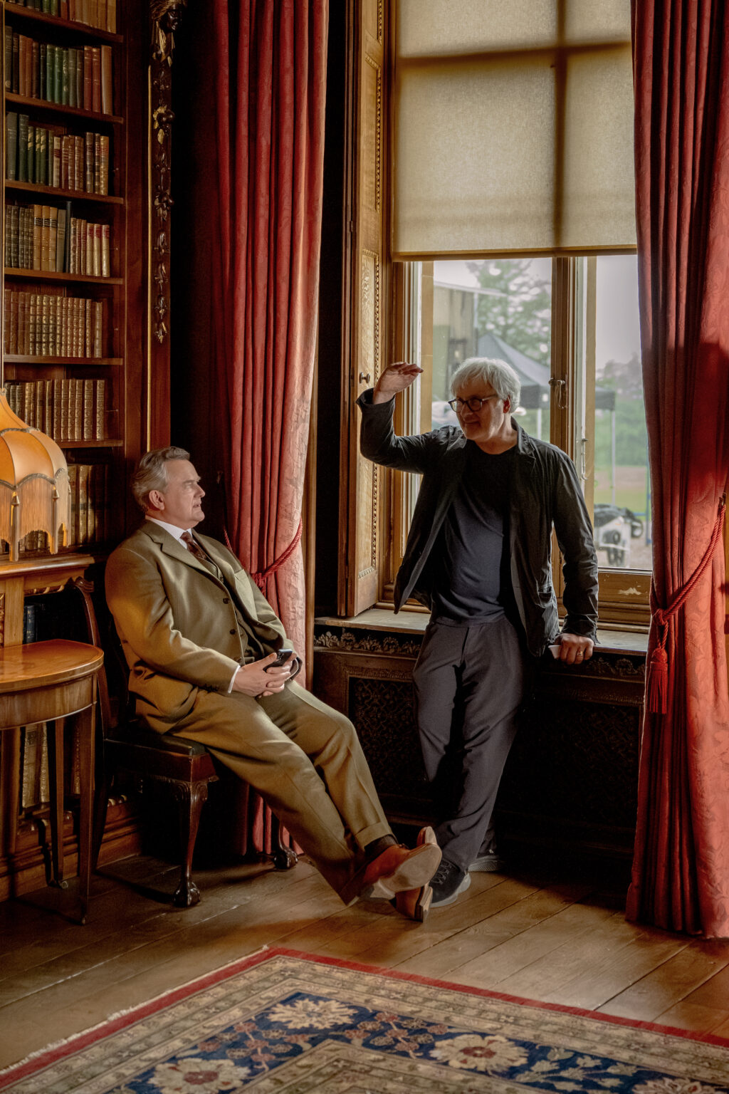 Actor Hugh Bonneville and director Simon Curtis on the set of their film DOWNTON ABBEY: The Grand Finale, a Focus Features release. Credit: Rory Mulvey / © 2025 FOCUS FEATURES LLC
