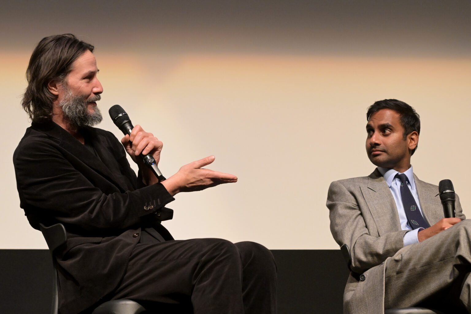 TORONTO, ONTARIO - SEPTEMBER 06: (L-R) Keanu Reeves and Aziz Ansari speak onstage during the “Good Fortune” World Premiere at the Toronto International Film Festival on September 06, 2025 in Toronto, Ontario. (Photo by Vivien Killilea/Getty Images for Lionsgate)
