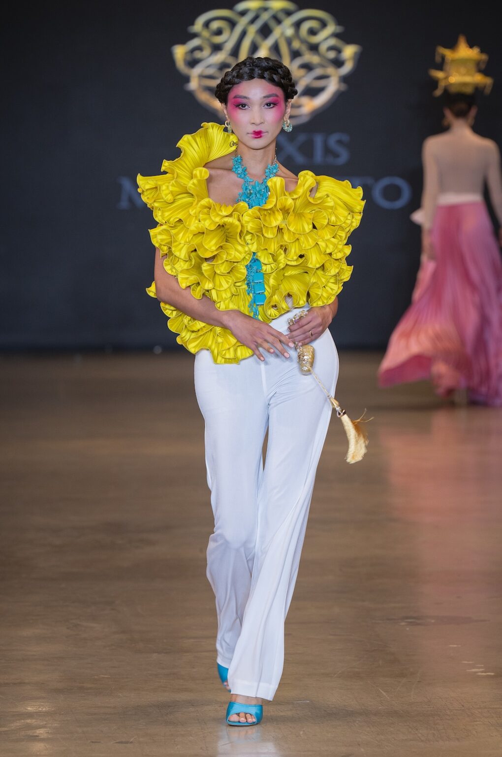 LOS ANGELES, CALIFORNIA - OCTOBER 16: A model walks the runway at the Alexis Monsanto show during Los Angeles Fashion Week Powered By Art Hearts Fashion at The New Mart on October 16, 2025 in Los Angeles, California. (Photo by Mark Gunter/Getty Images for Art Hearts Fashion)