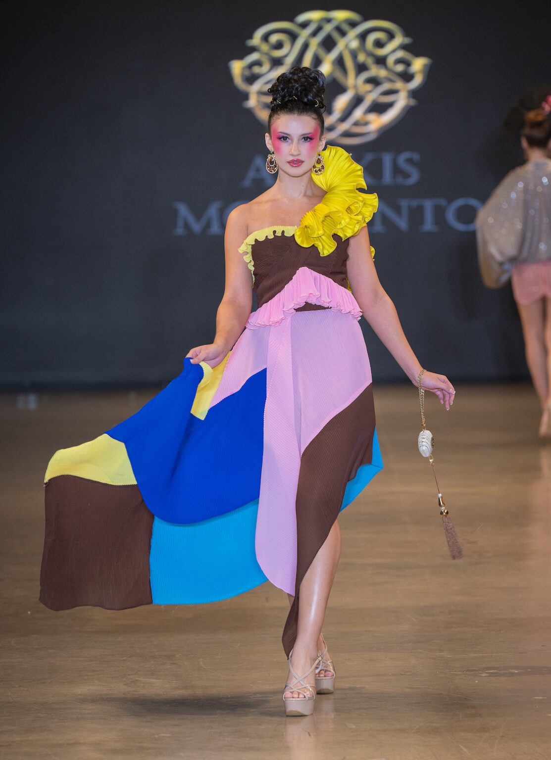 LOS ANGELES, CALIFORNIA - OCTOBER 16: A model walks the runway at the Alexis Monsanto show during Los Angeles Fashion Week Powered By Art Hearts Fashion at The New Mart on October 16, 2025 in Los Angeles, California. (Photo by Mark Gunter/Getty Images for Art Hearts Fashion)