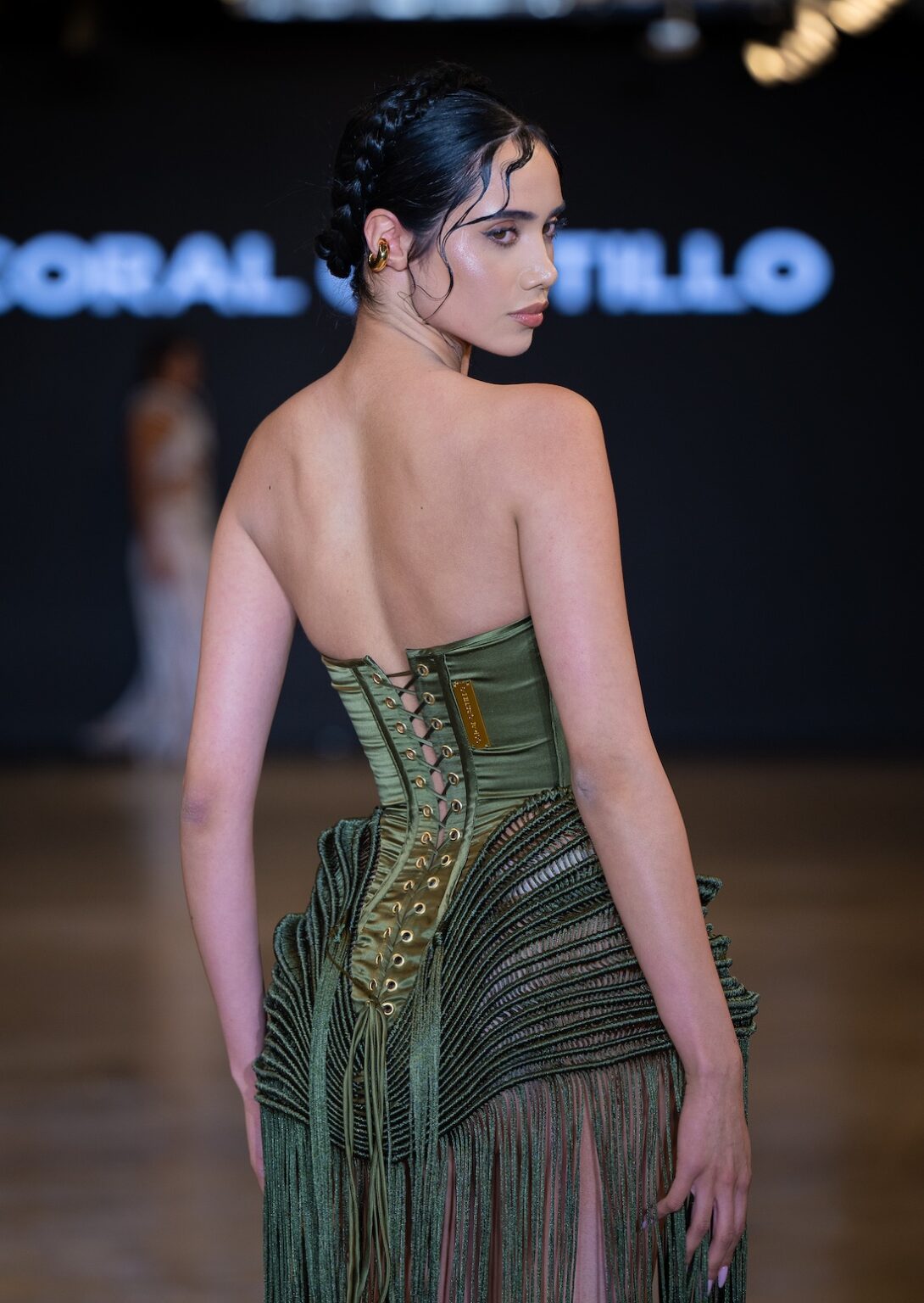 LOS ANGELES, CALIFORNIA - OCTOBER 16: A model walks the runway at the Coral Castillo show during Los Angeles Fashion Week Powered By Art Hearts Fashion at The New Mart on October 16, 2025 in Los Angeles, California. (Photo by Mark Gunter/Getty Images for Art Hearts Fashion)