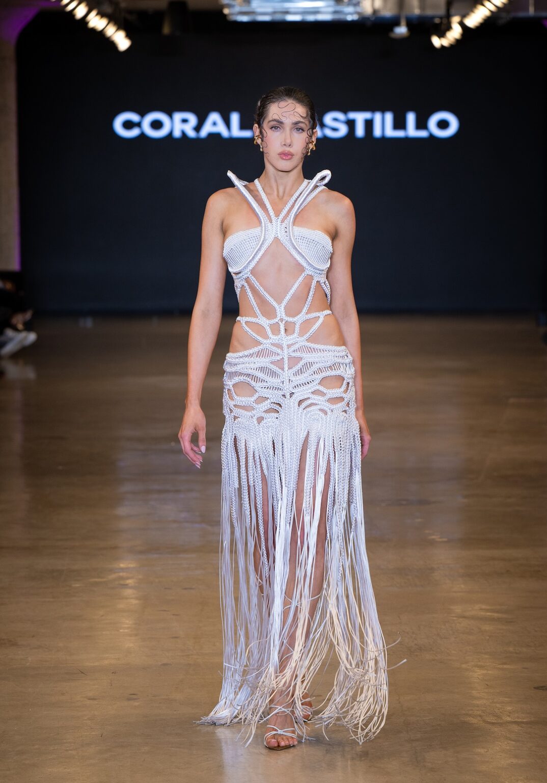 LOS ANGELES, CALIFORNIA - OCTOBER 16: A model walks the runway at the Coral Castillo show during Los Angeles Fashion Week Powered By Art Hearts Fashion at The New Mart on October 16, 2025 in Los Angeles, California. (Photo by Mark Gunter/Getty Images for Art Hearts Fashion)