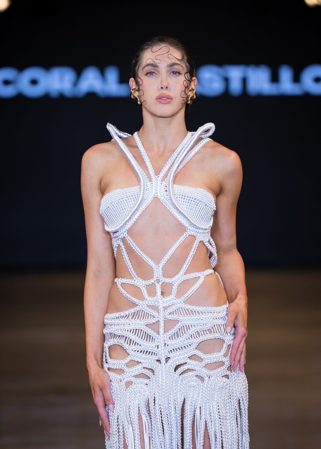 LOS ANGELES, CALIFORNIA - OCTOBER 16: A model walks the runway at the Coral Castillo show during Los Angeles Fashion Week Powered By Art Hearts Fashion at The New Mart on October 16, 2025 in Los Angeles, California. (Photo by Mark Gunter/Getty Images for Art Hearts Fashion)