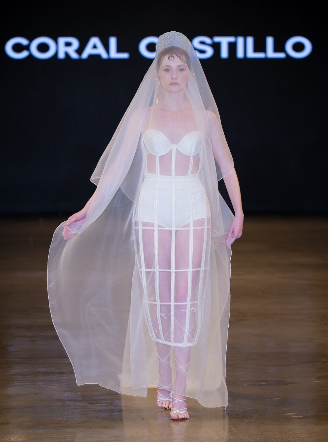 LOS ANGELES, CALIFORNIA - OCTOBER 16: A model walks the runway at the Coral Castillo show during Los Angeles Fashion Week Powered By Art Hearts Fashion at The New Mart on October 16, 2025 in Los Angeles, California. (Photo by Mark Gunter/Getty Images for Art Hearts Fashion)