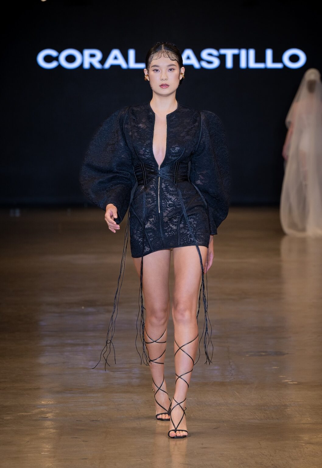 LOS ANGELES, CALIFORNIA - OCTOBER 16: A model walks the runway at the Coral Castillo show during Los Angeles Fashion Week Powered By Art Hearts Fashion at The New Mart on October 16, 2025 in Los Angeles, California. (Photo by Mark Gunter/Getty Images for Art Hearts Fashion)