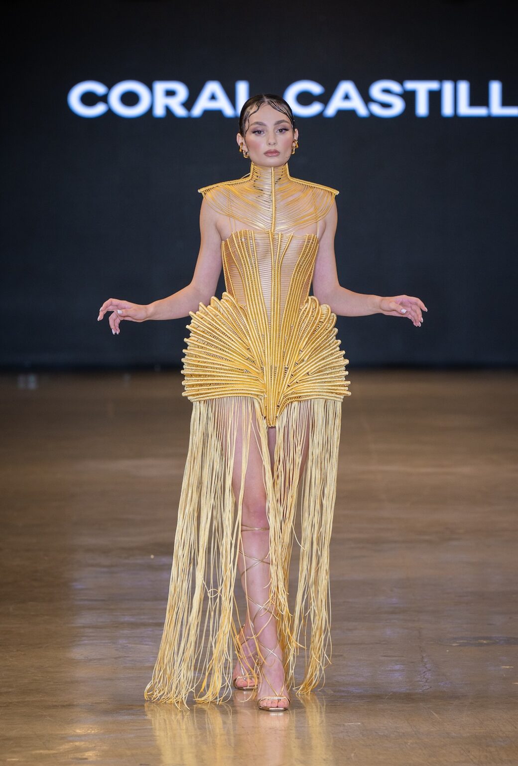 LOS ANGELES, CALIFORNIA - OCTOBER 16: A model walks the runway at the Coral Castillo show during Los Angeles Fashion Week Powered By Art Hearts Fashion at The New Mart on October 16, 2025 in Los Angeles, California. (Photo by Mark Gunter/Getty Images for Art Hearts Fashion)