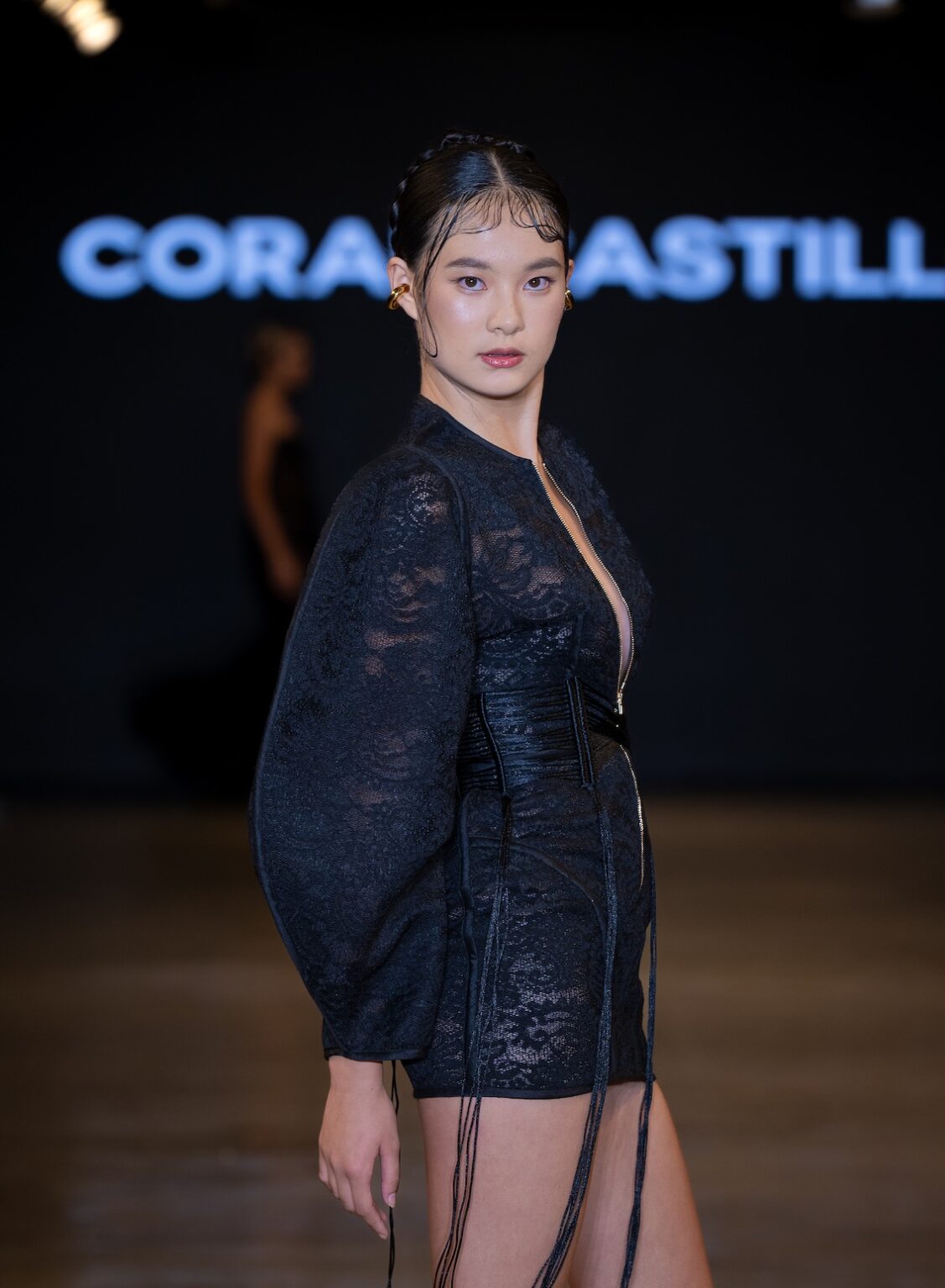 LOS ANGELES, CALIFORNIA - OCTOBER 16: A model walks the runway at the Coral Castillo show during Los Angeles Fashion Week Powered By Art Hearts Fashion at The New Mart on October 16, 2025 in Los Angeles, California. (Photo by Mark Gunter/Getty Images for Art Hearts Fashion)
