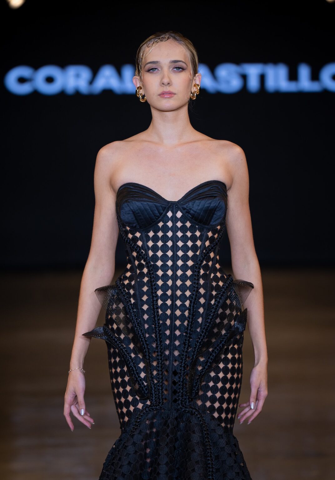 LOS ANGELES, CALIFORNIA - OCTOBER 16: A model walks the runway at the Coral Castillo show during Los Angeles Fashion Week Powered By Art Hearts Fashion at The New Mart on October 16, 2025 in Los Angeles, California. (Photo by Mark Gunter/Getty Images for Art Hearts Fashion)