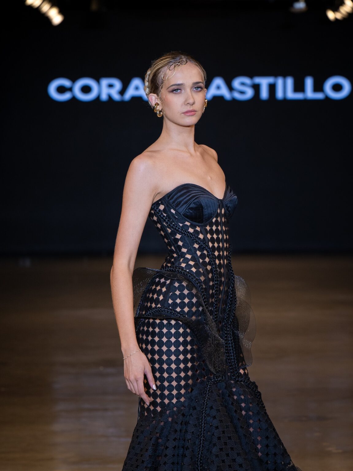 LOS ANGELES, CALIFORNIA - OCTOBER 16: A model walks the runway at the Coral Castillo show during Los Angeles Fashion Week Powered By Art Hearts Fashion at The New Mart on October 16, 2025 in Los Angeles, California. (Photo by Mark Gunter/Getty Images for Art Hearts Fashion)
