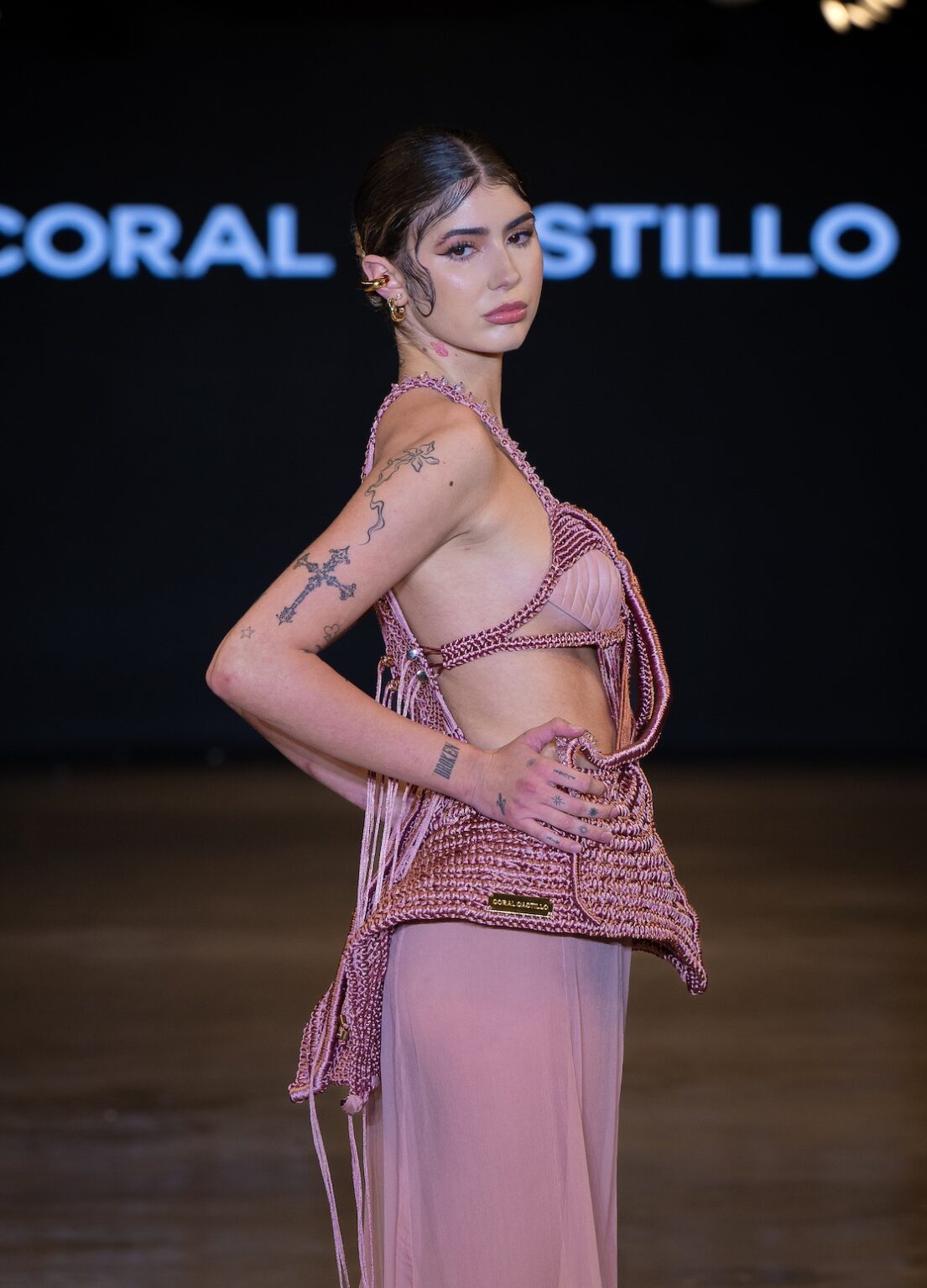 LOS ANGELES, CALIFORNIA - OCTOBER 16: A model walks the runway at the Coral Castillo show during Los Angeles Fashion Week Powered By Art Hearts Fashion at The New Mart on October 16, 2025 in Los Angeles, California. (Photo by Mark Gunter/Getty Images for Art Hearts Fashion)