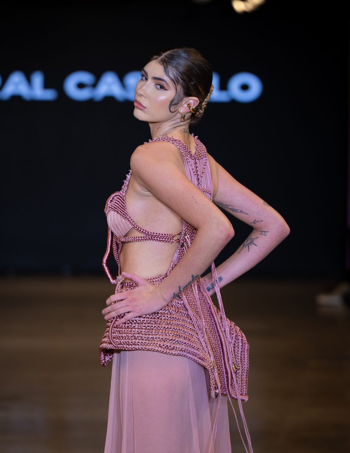 LOS ANGELES, CALIFORNIA - OCTOBER 16: A model walks the runway at the Coral Castillo show during Los Angeles Fashion Week Powered By Art Hearts Fashion at The New Mart on October 16, 2025 in Los Angeles, California. (Photo by Mark Gunter/Getty Images for Art Hearts Fashion)