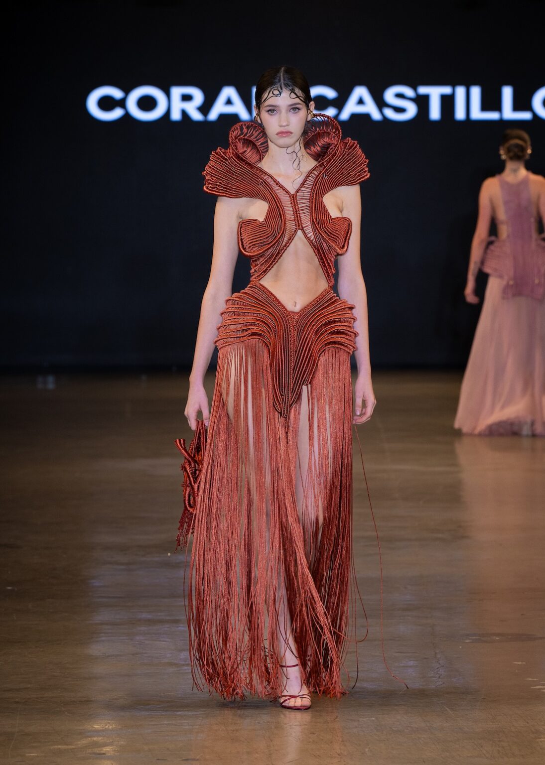 LOS ANGELES, CALIFORNIA - OCTOBER 16: A model walks the runway at the Coral Castillo show during Los Angeles Fashion Week Powered By Art Hearts Fashion at The New Mart on October 16, 2025 in Los Angeles, California. (Photo by Mark Gunter/Getty Images for Art Hearts Fashion)