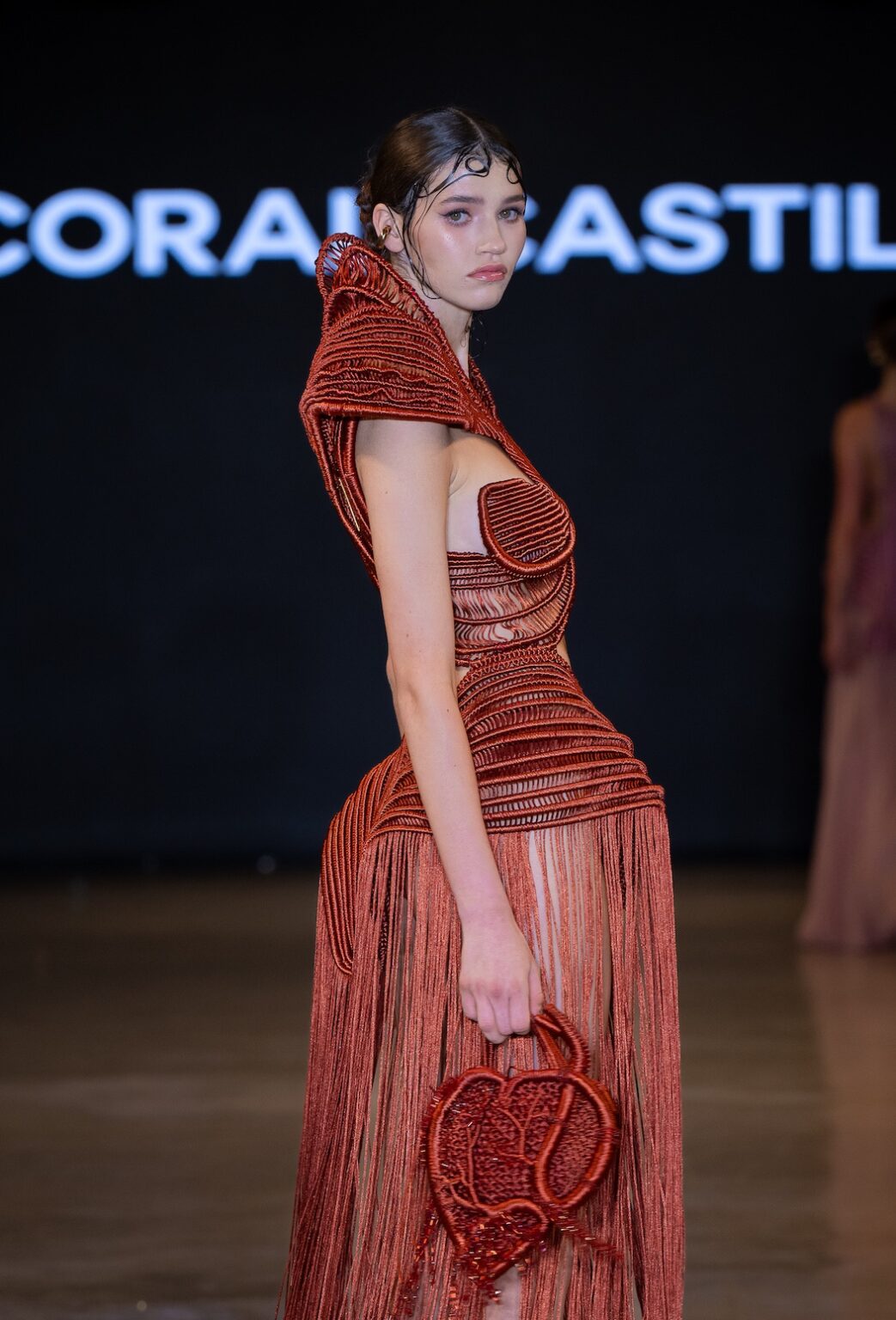 LOS ANGELES, CALIFORNIA - OCTOBER 16: A model walks the runway at the Coral Castillo show during Los Angeles Fashion Week Powered By Art Hearts Fashion at The New Mart on October 16, 2025 in Los Angeles, California. (Photo by Mark Gunter/Getty Images for Art Hearts Fashion)