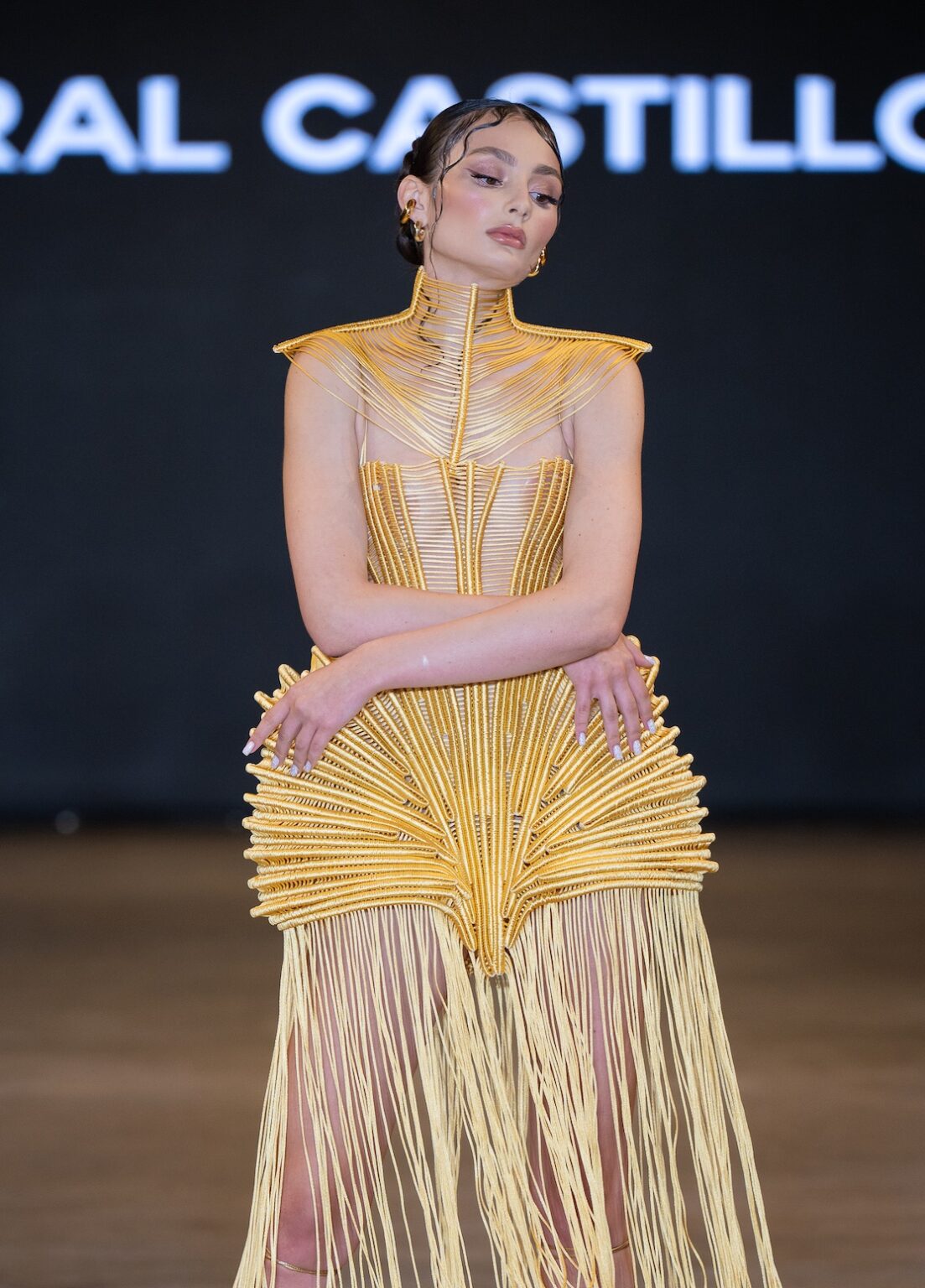 LOS ANGELES, CALIFORNIA - OCTOBER 16: A model walks the runway at the Coral Castillo show during Los Angeles Fashion Week Powered By Art Hearts Fashion at The New Mart on October 16, 2025 in Los Angeles, California. (Photo by Mark Gunter/Getty Images for Art Hearts Fashion)