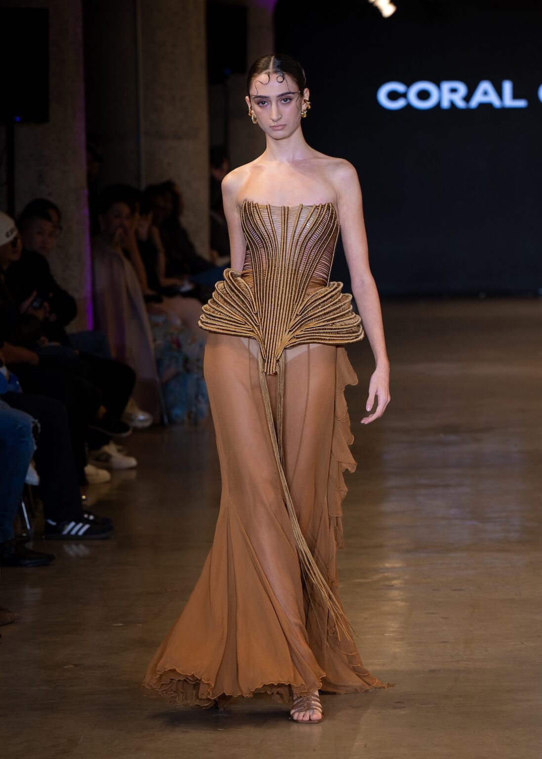 LOS ANGELES, CALIFORNIA - OCTOBER 16: A model walks the runway at the Coral Castillo show during Los Angeles Fashion Week Powered By Art Hearts Fashion at The New Mart on October 16, 2025 in Los Angeles, California. (Photo by Mark Gunter/Getty Images for Art Hearts Fashion)