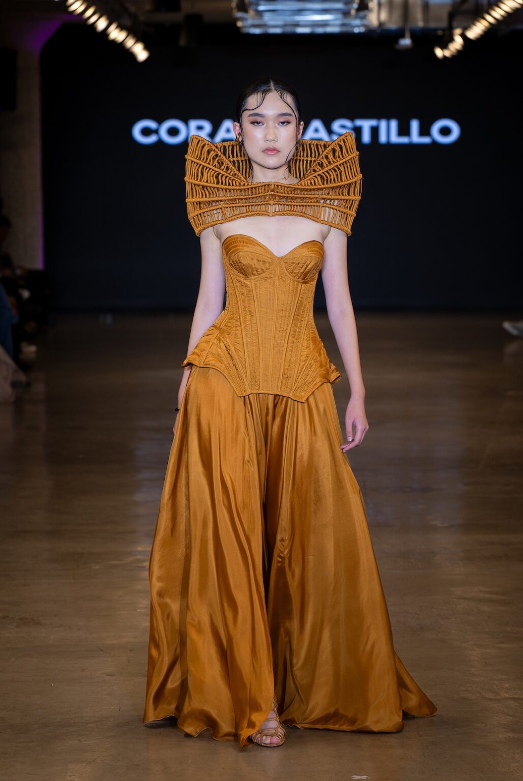 LOS ANGELES, CALIFORNIA - OCTOBER 16: A model walks the runway at the Coral Castillo show during Los Angeles Fashion Week Powered By Art Hearts Fashion at The New Mart on October 16, 2025 in Los Angeles, California. (Photo by Mark Gunter/Getty Images for Art Hearts Fashion)