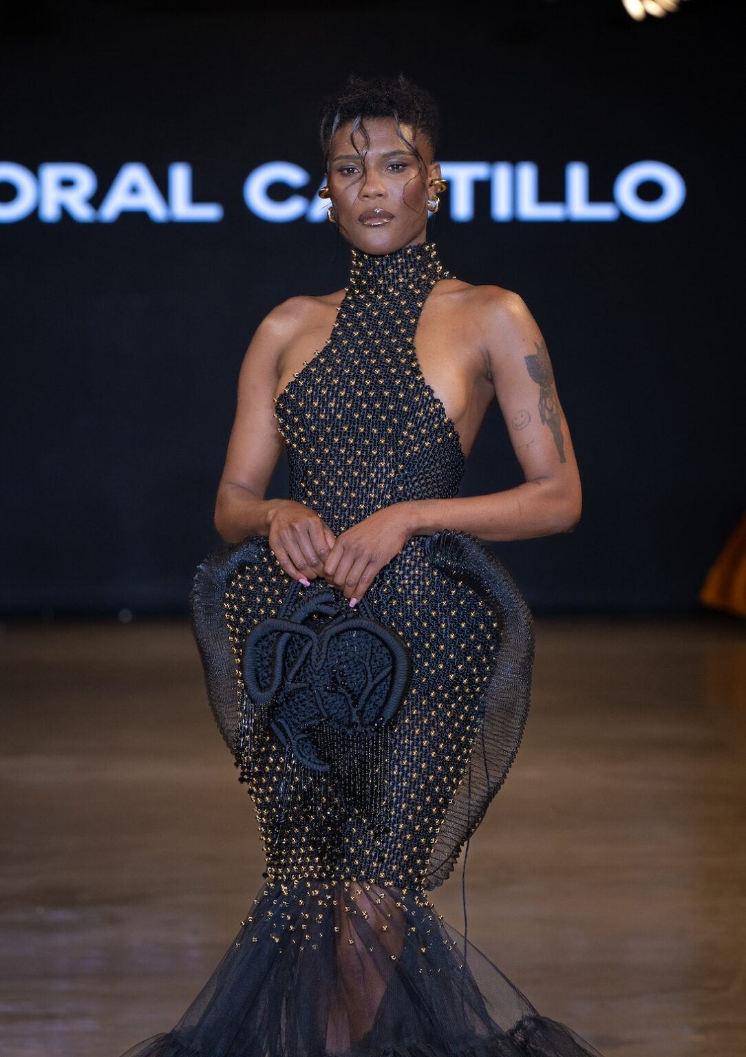 LOS ANGELES, CALIFORNIA - OCTOBER 16: A model walks the runway at the Coral Castillo show during Los Angeles Fashion Week Powered By Art Hearts Fashion at The New Mart on October 16, 2025 in Los Angeles, California. (Photo by Mark Gunter/Getty Images for Art Hearts Fashion)