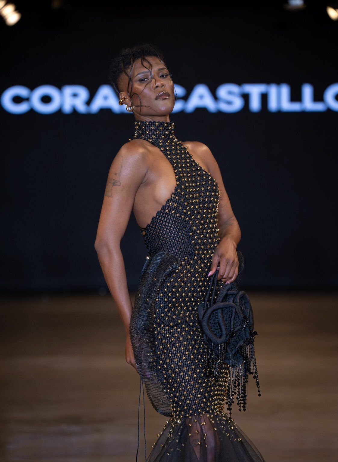 LOS ANGELES, CALIFORNIA - OCTOBER 16: A model walks the runway at the Coral Castillo show during Los Angeles Fashion Week Powered By Art Hearts Fashion at The New Mart on October 16, 2025 in Los Angeles, California. (Photo by Mark Gunter/Getty Images for Art Hearts Fashion)