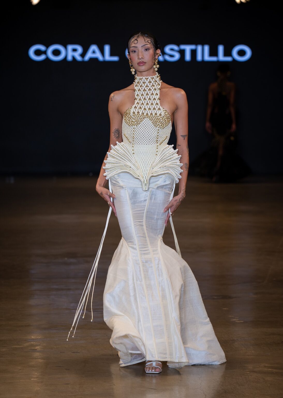 LOS ANGELES, CALIFORNIA - OCTOBER 16: A model walks the runway at the Coral Castillo show during Los Angeles Fashion Week Powered By Art Hearts Fashion at The New Mart on October 16, 2025 in Los Angeles, California. (Photo by Mark Gunter/Getty Images for Art Hearts Fashion)