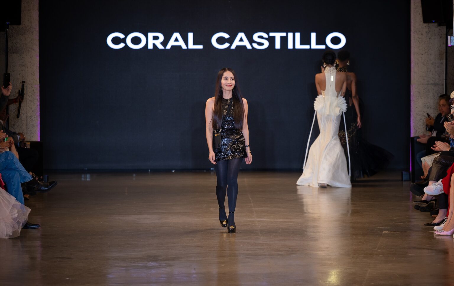 LOS ANGELES, CALIFORNIA - OCTOBER 16: Designer Coral Castillo walks the runway at the Coral Castillo show during Los Angeles Fashion Week Powered By Art Hearts Fashion at The New Mart on October 16, 2025 in Los Angeles, California. (Photo by Mark Gunter/Getty Images for Art Hearts Fashion)