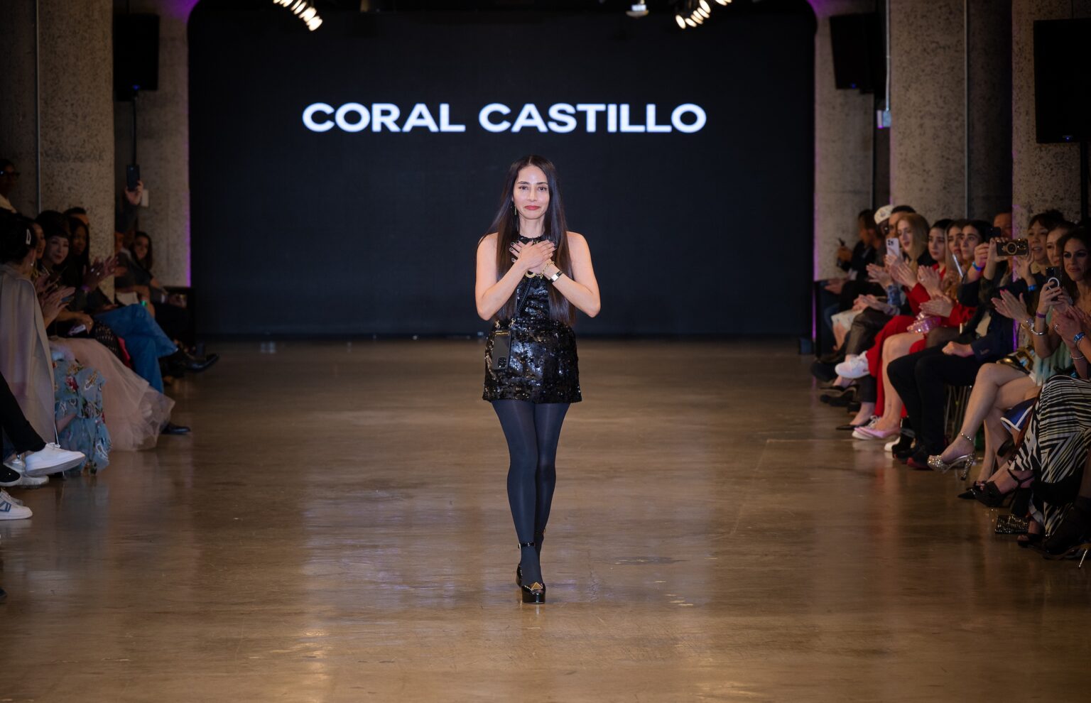 LOS ANGELES, CALIFORNIA - OCTOBER 16: Designer Coral Castillo walks the runway at the Coral Castillo show during Los Angeles Fashion Week Powered By Art Hearts Fashion at The New Mart on October 16, 2025 in Los Angeles, California. (Photo by Mark Gunter/Getty Images for Art Hearts Fashion)