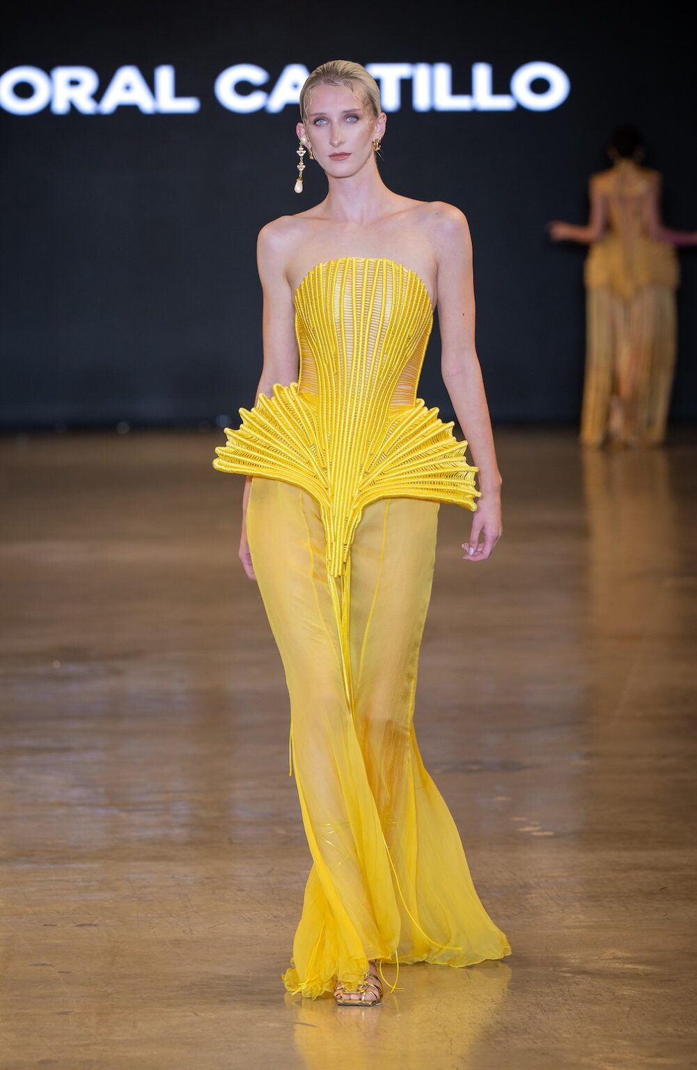 LOS ANGELES, CALIFORNIA - OCTOBER 16: A model walks the runway at the Coral Castillo show during Los Angeles Fashion Week Powered By Art Hearts Fashion at The New Mart on October 16, 2025 in Los Angeles, California. (Photo by Mark Gunter/Getty Images for Art Hearts Fashion)