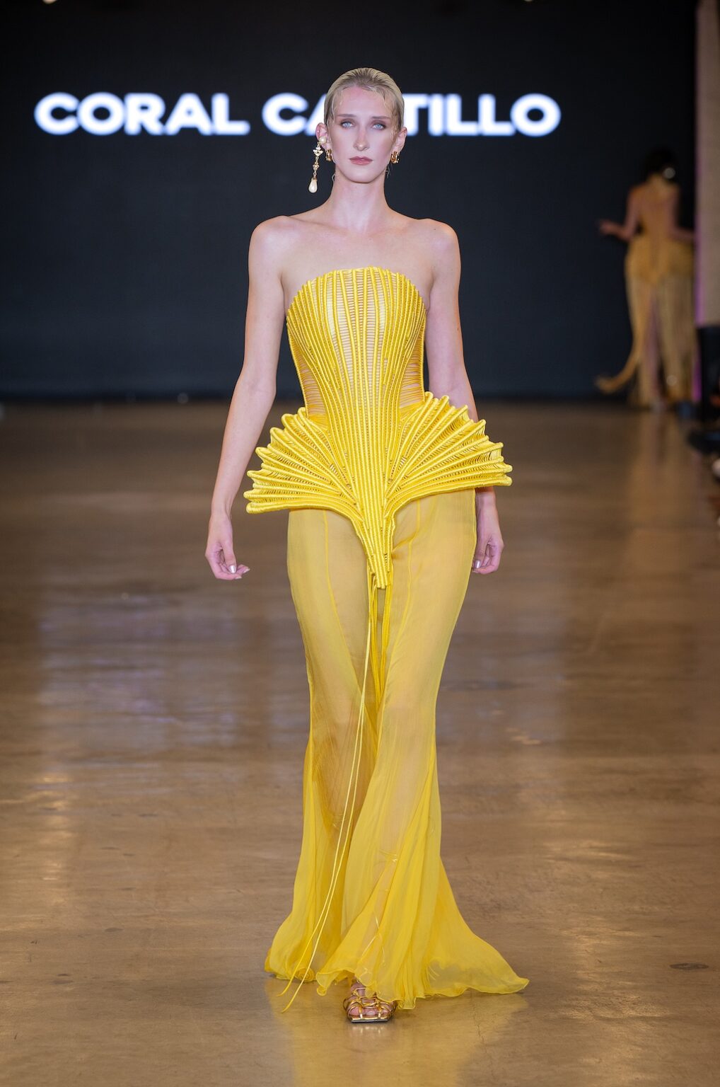 LOS ANGELES, CALIFORNIA - OCTOBER 16: A model walks the runway at the Coral Castillo show during Los Angeles Fashion Week Powered By Art Hearts Fashion at The New Mart on October 16, 2025 in Los Angeles, California. (Photo by Mark Gunter/Getty Images for Art Hearts Fashion)