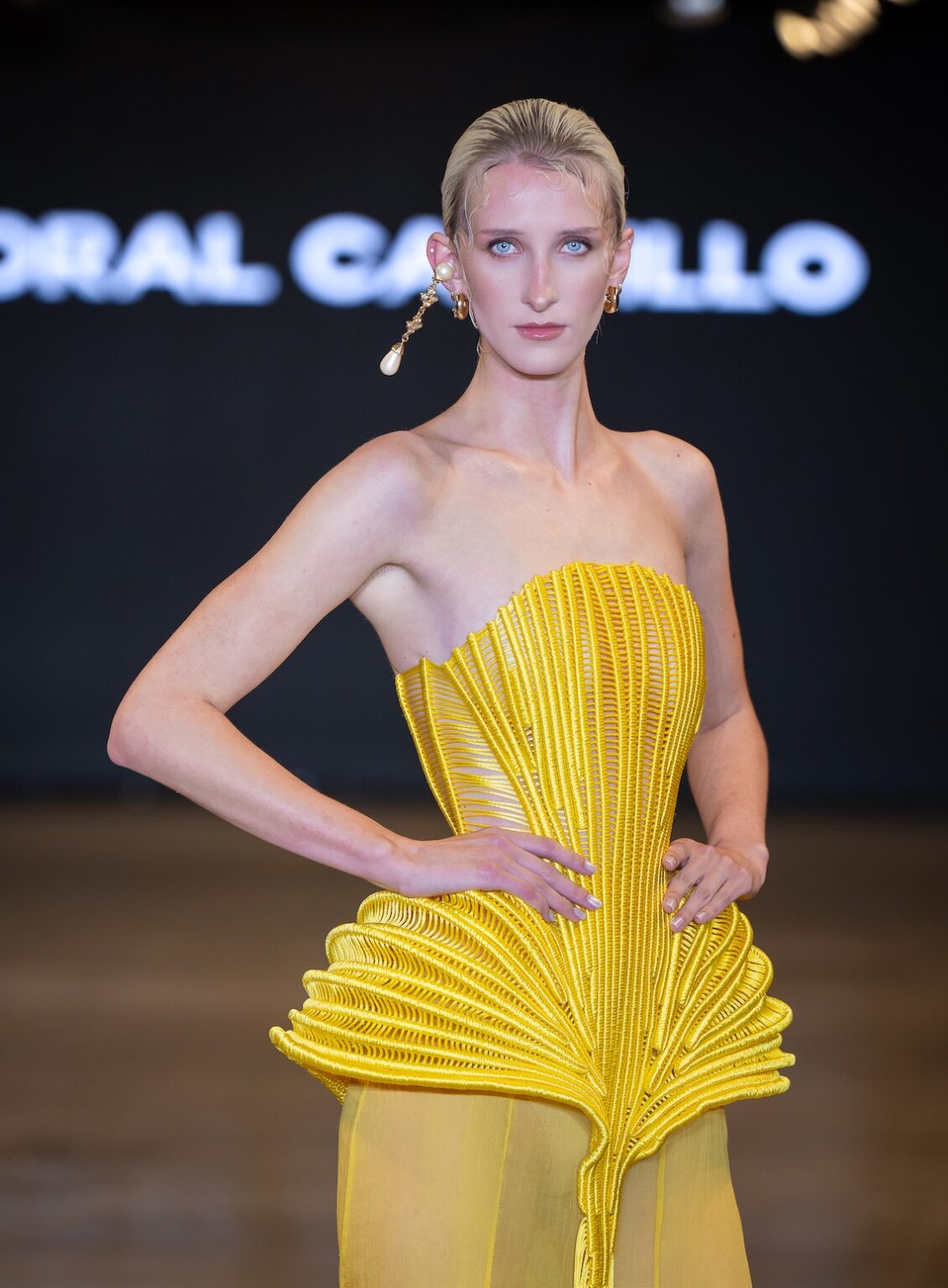 LOS ANGELES, CALIFORNIA - OCTOBER 16: A model walks the runway at the Coral Castillo show during Los Angeles Fashion Week Powered By Art Hearts Fashion at The New Mart on October 16, 2025 in Los Angeles, California. (Photo by Mark Gunter/Getty Images for Art Hearts Fashion)